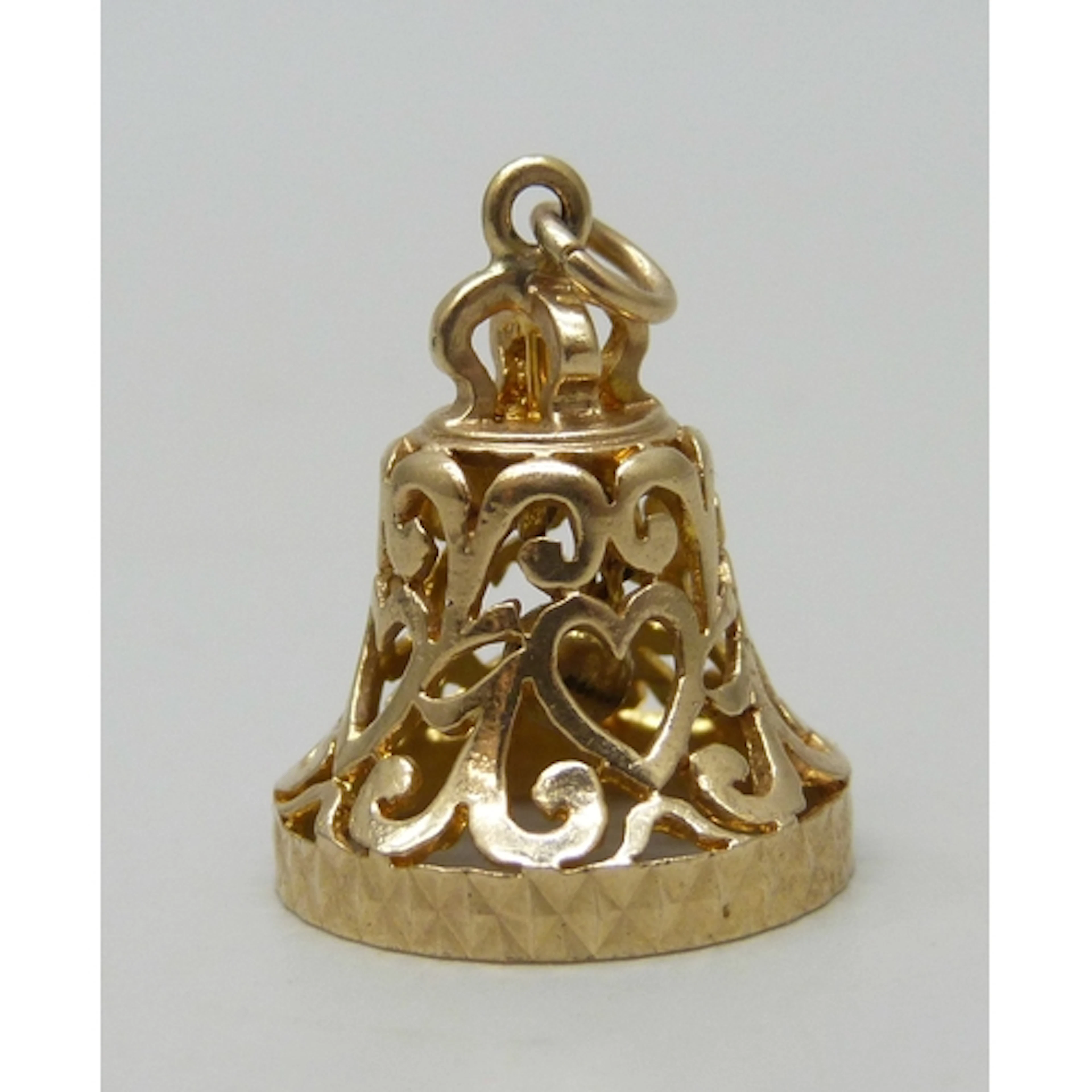 A 9ct gold charm in the form of a bell, 3.8g, 2.5cm includin...