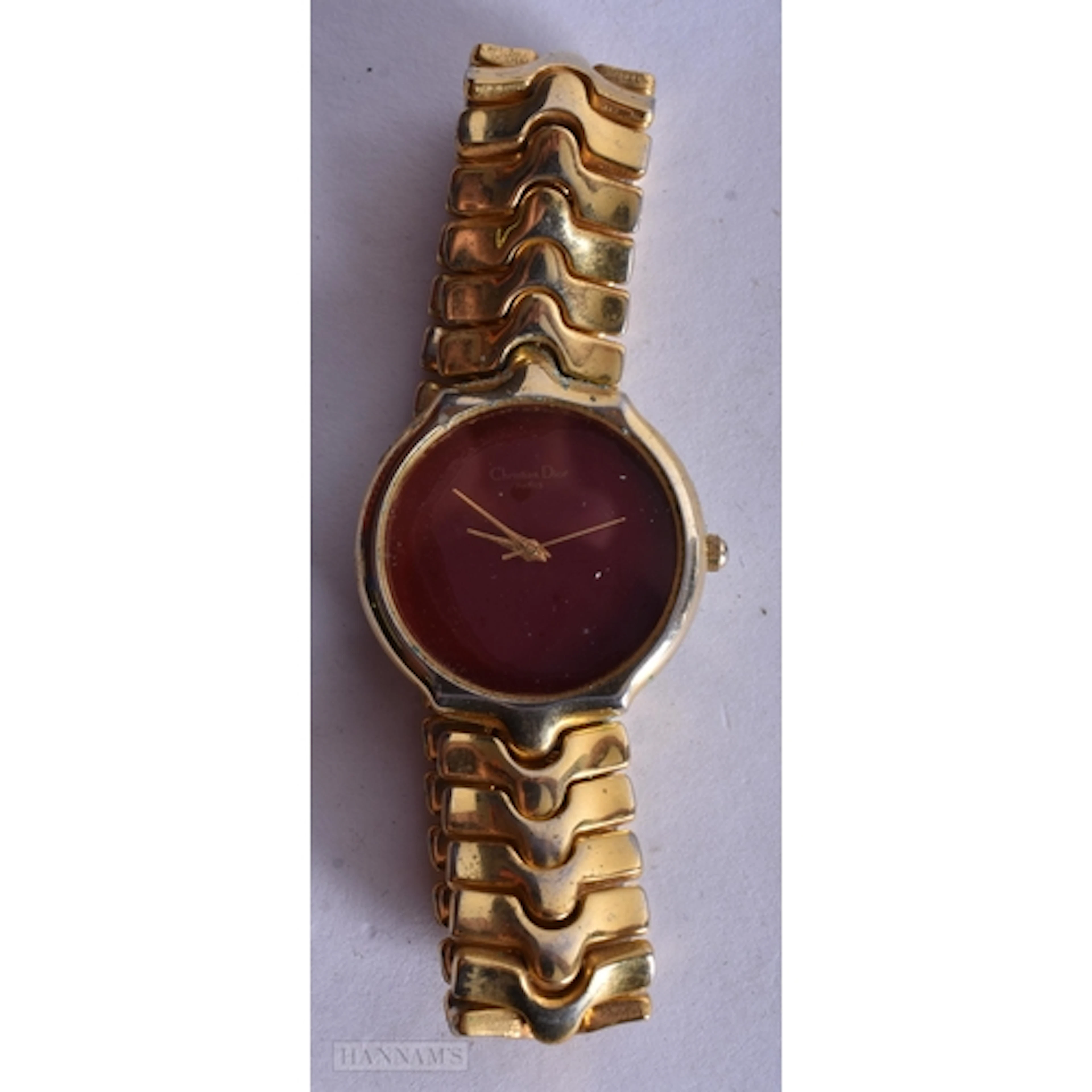 A RED DIAL CHRISTIAN DIOR LADIES WATCH, untested, 2.4cm inc ...