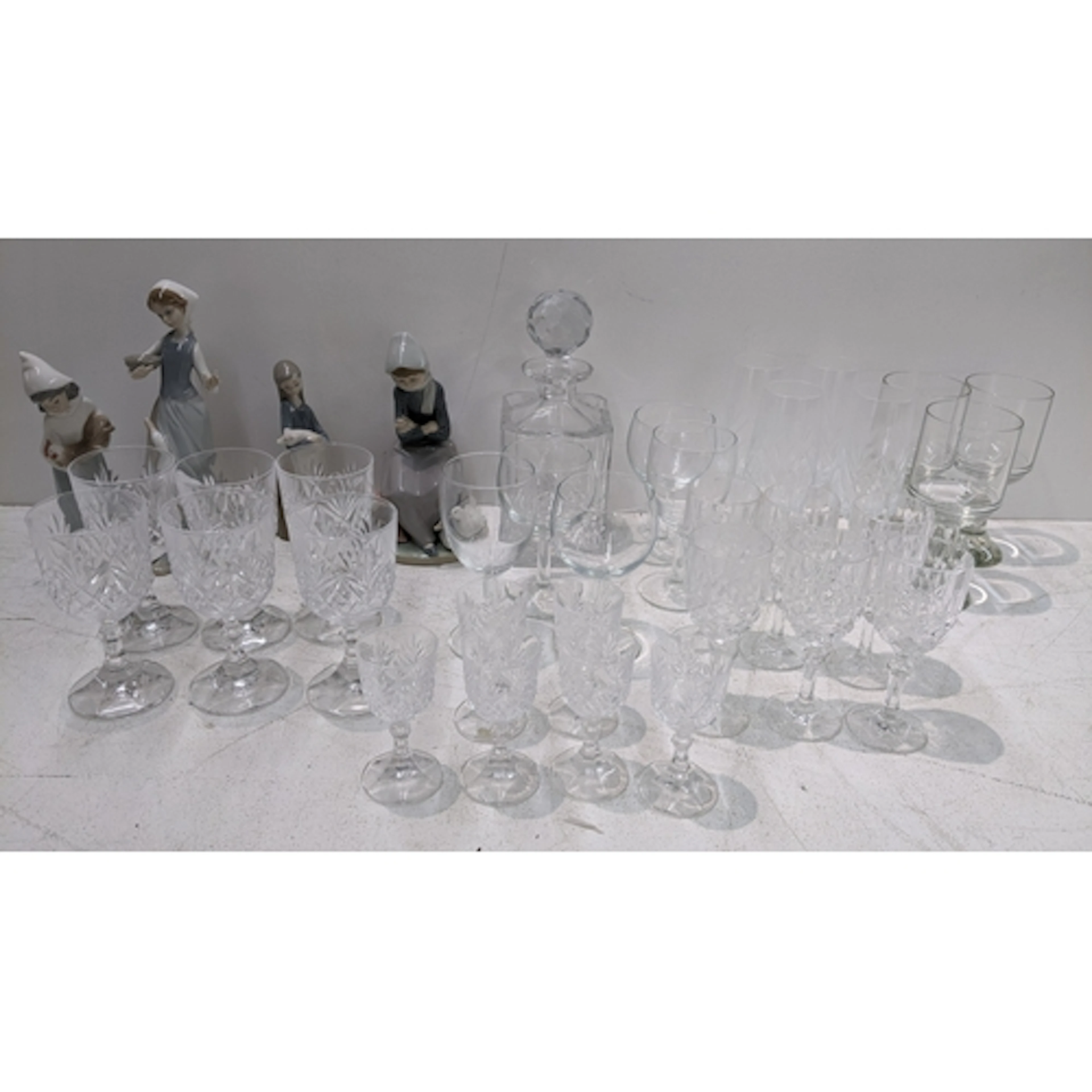 Four Lladro figures together with a selection of glassware ...