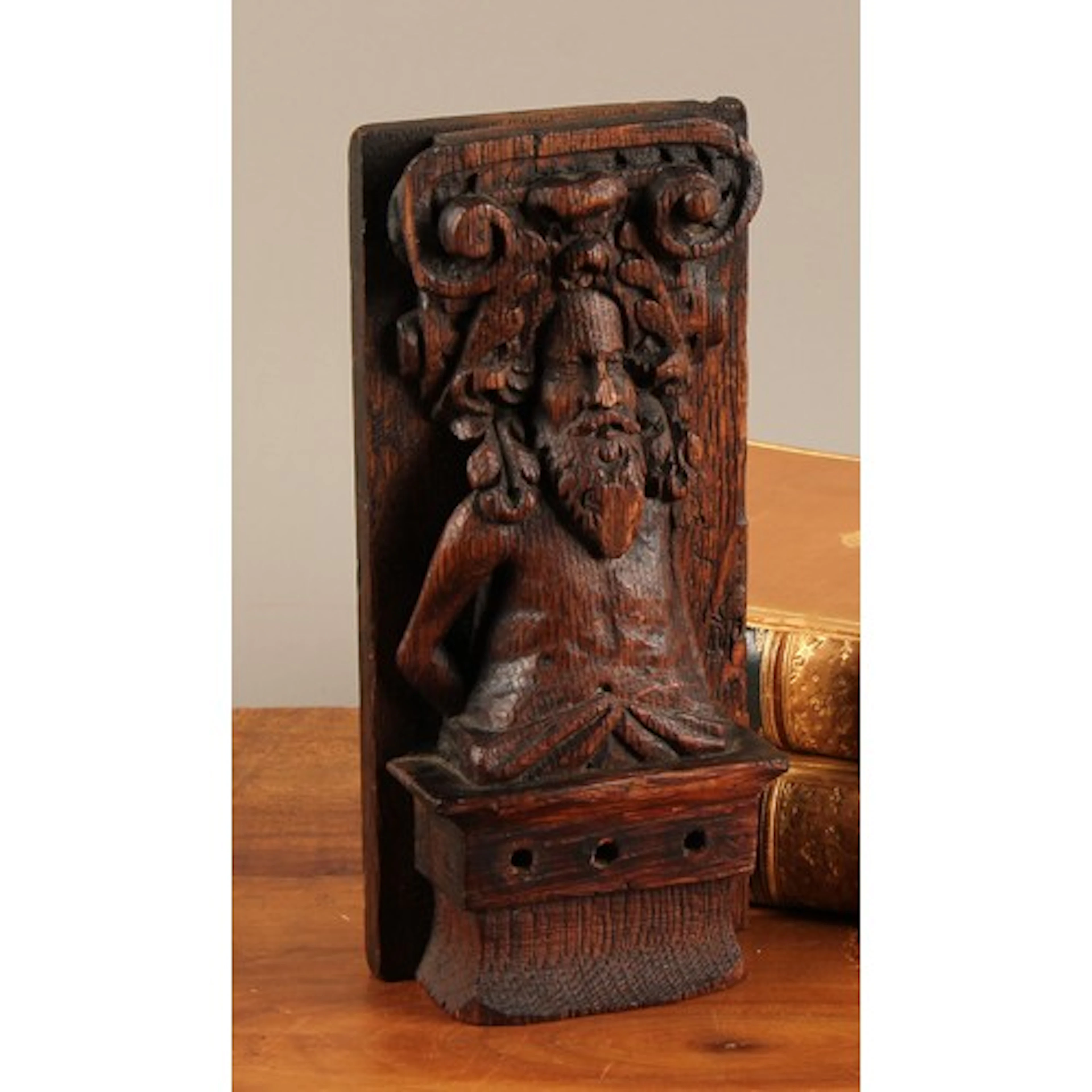A 17th century oak pilaster fragment, carved as a bearded ma...