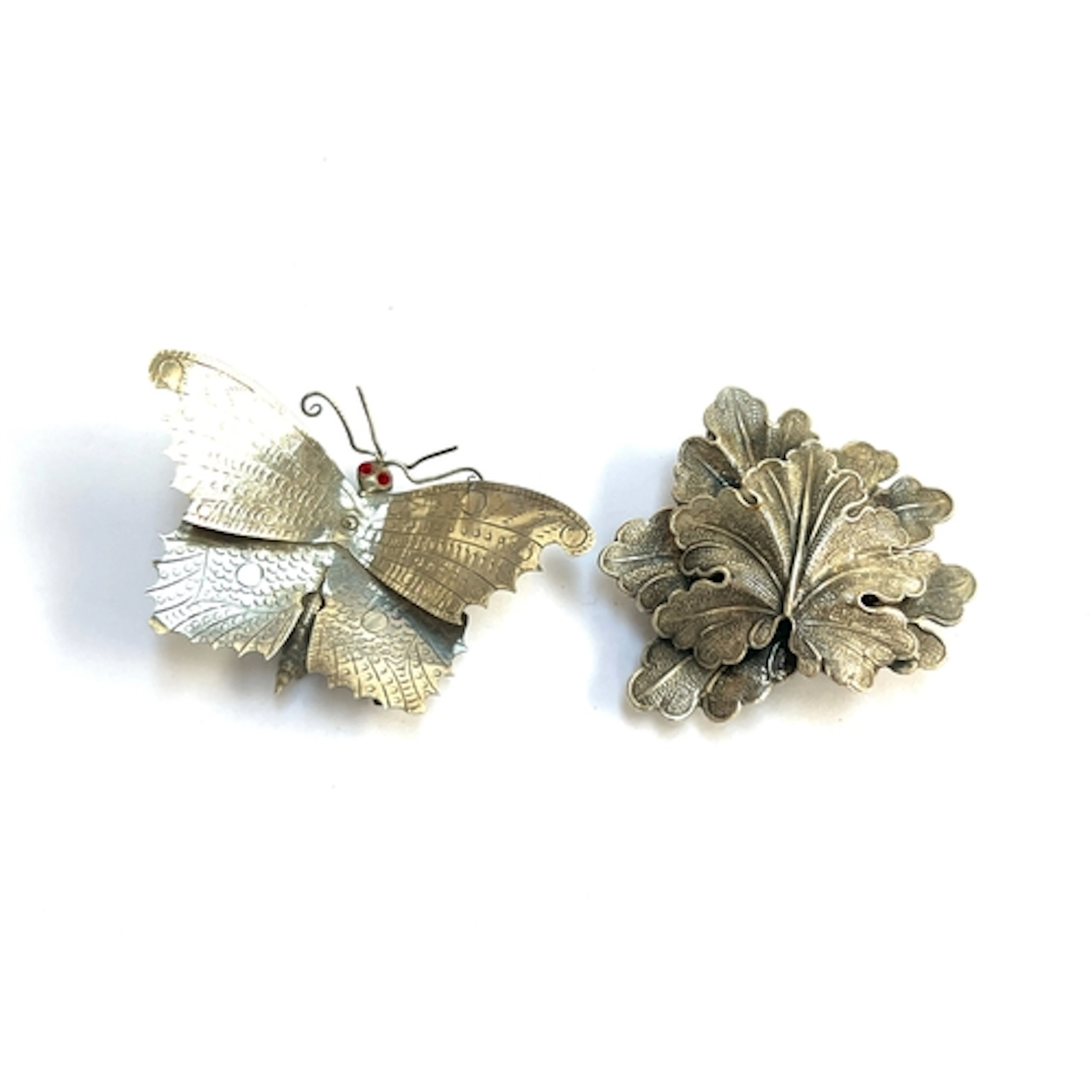 A naturalistic white metal butterfly brooch, 6cmW; together ...