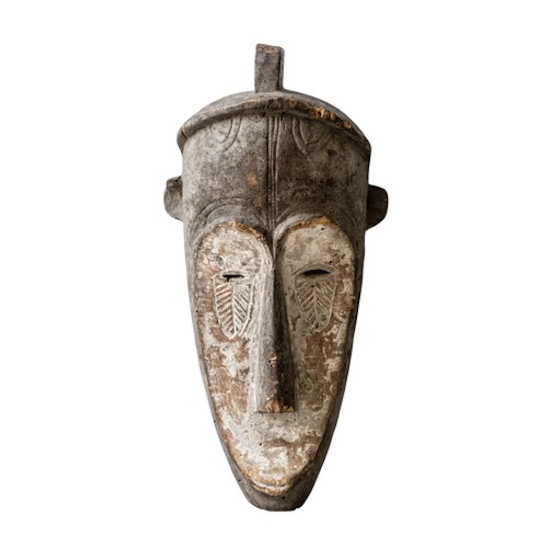 A FANG MASK of elongated form with slender long nose, narrow...