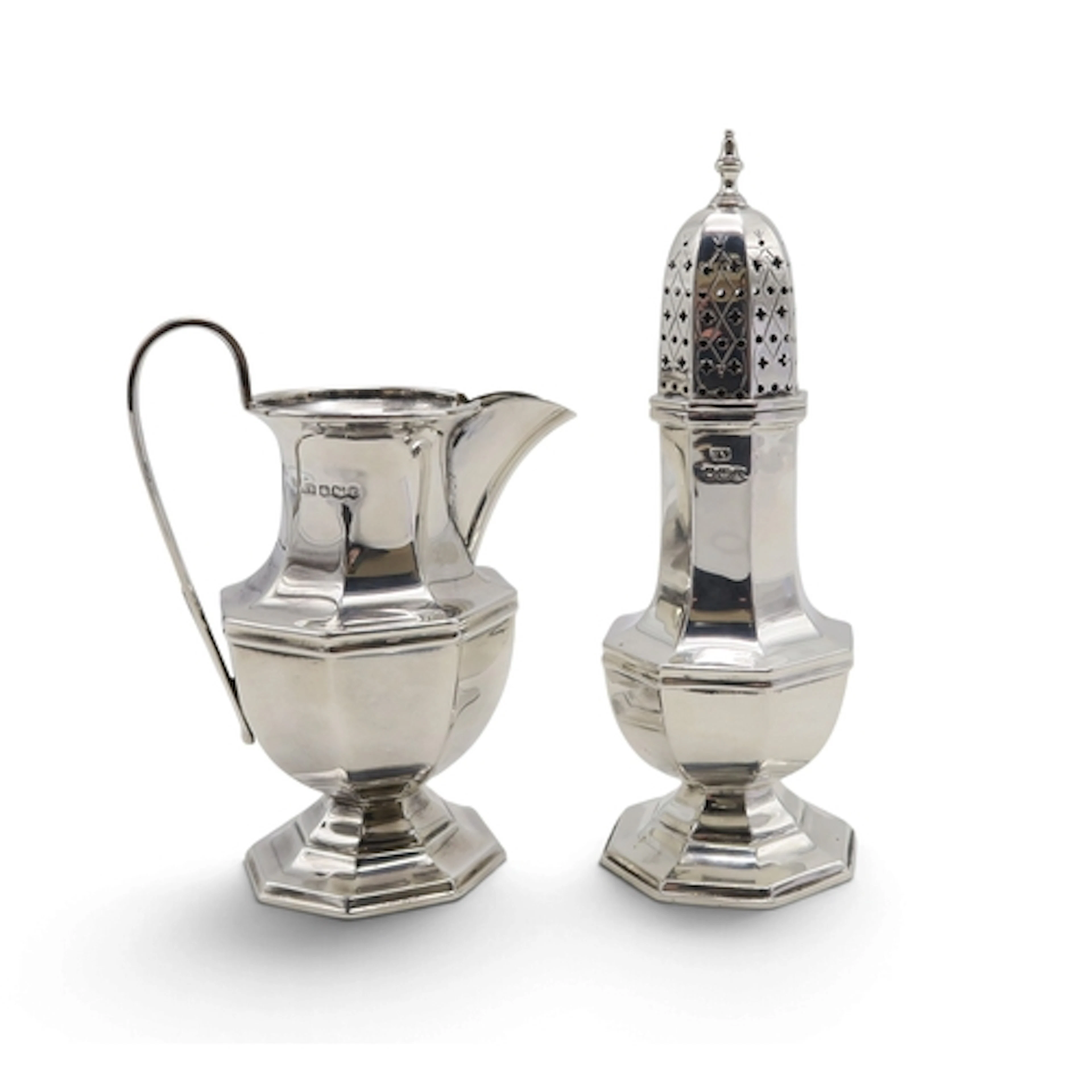 A matched George VI silver sugar caster and cream jug, both ...