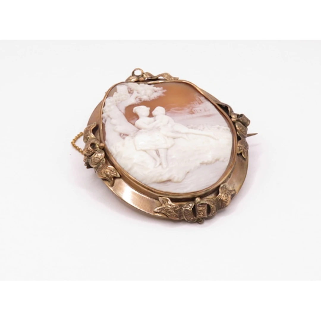Victorian cameo brooch carved with a scene depicting lovers ...