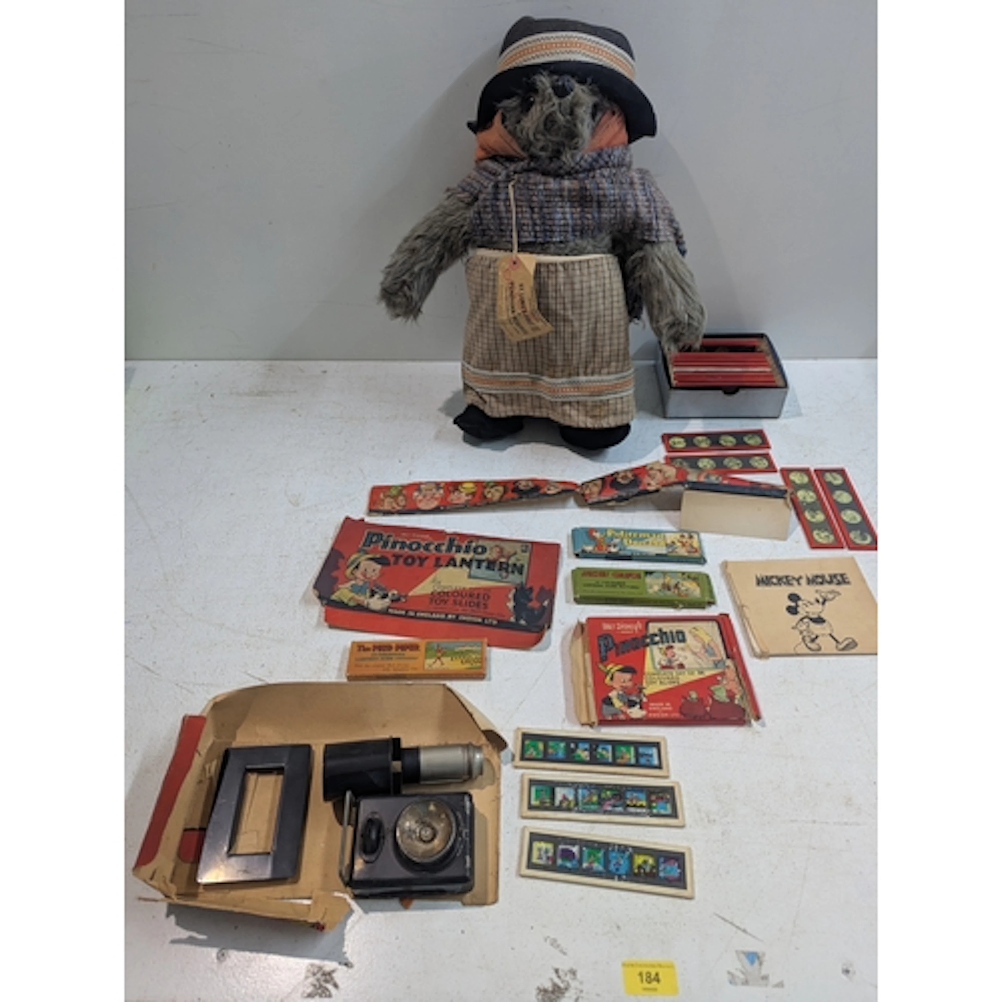 A Gabrielle Designs Aunt Lucy bear along with a Walt Disney ...