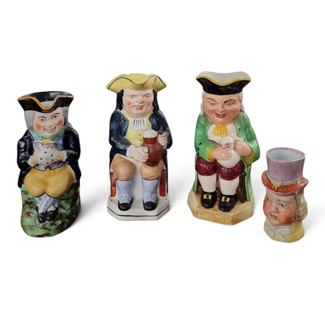 A group of four 19th Century Toby Jugs. TB 23 cm approx.