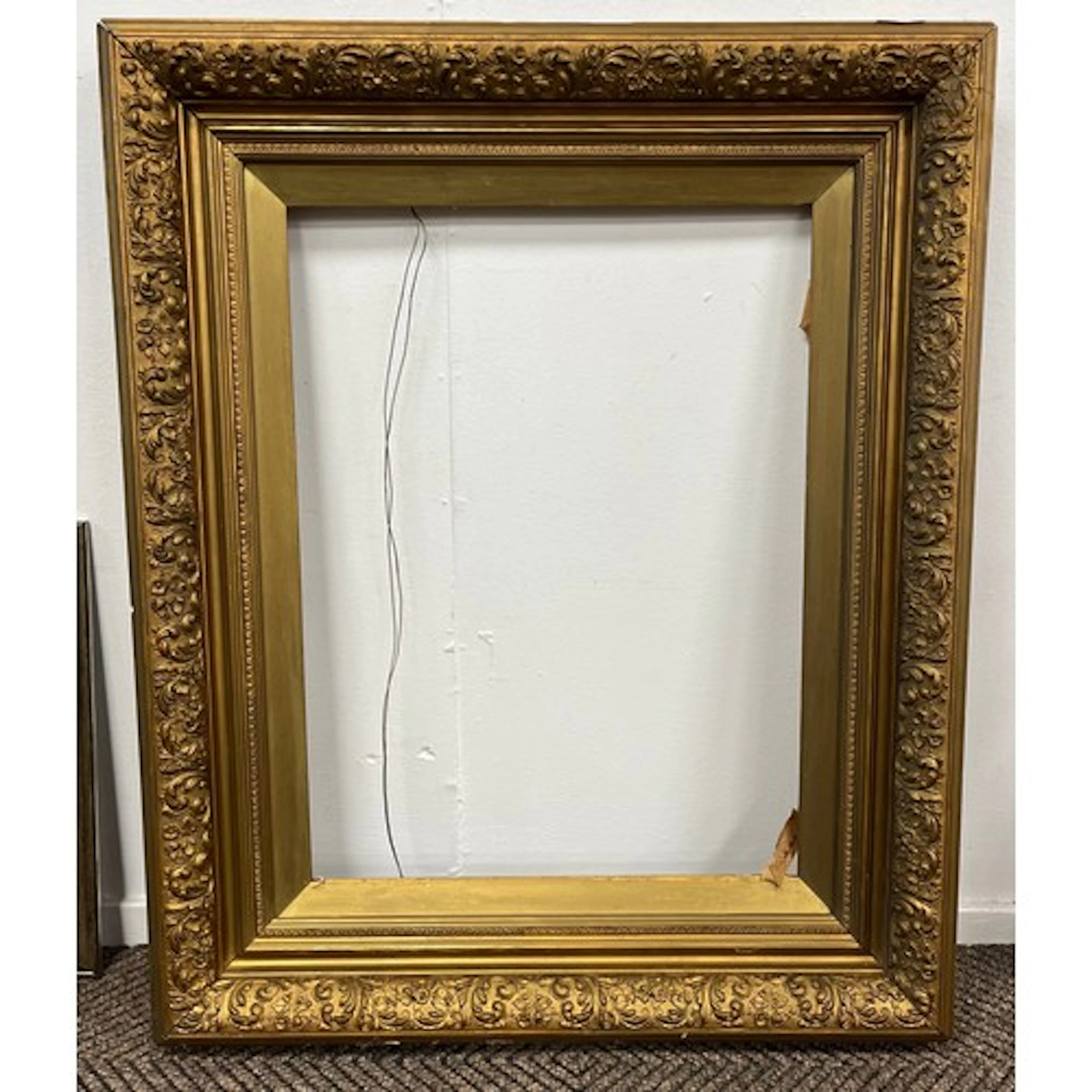 Large Ornate gilt frame, 87cm by 73cm.