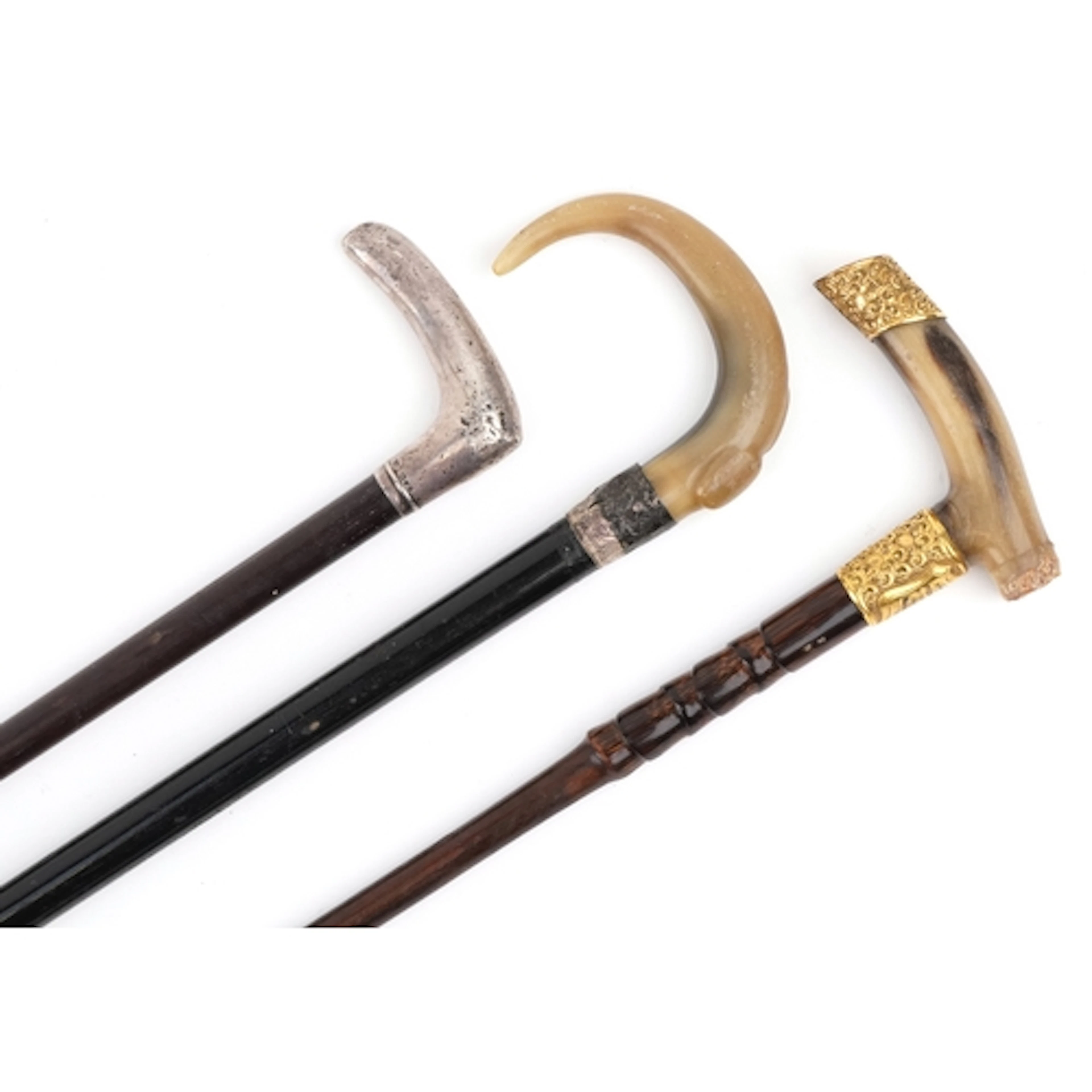 Three Victorian and later walking sticks including an ebonis...