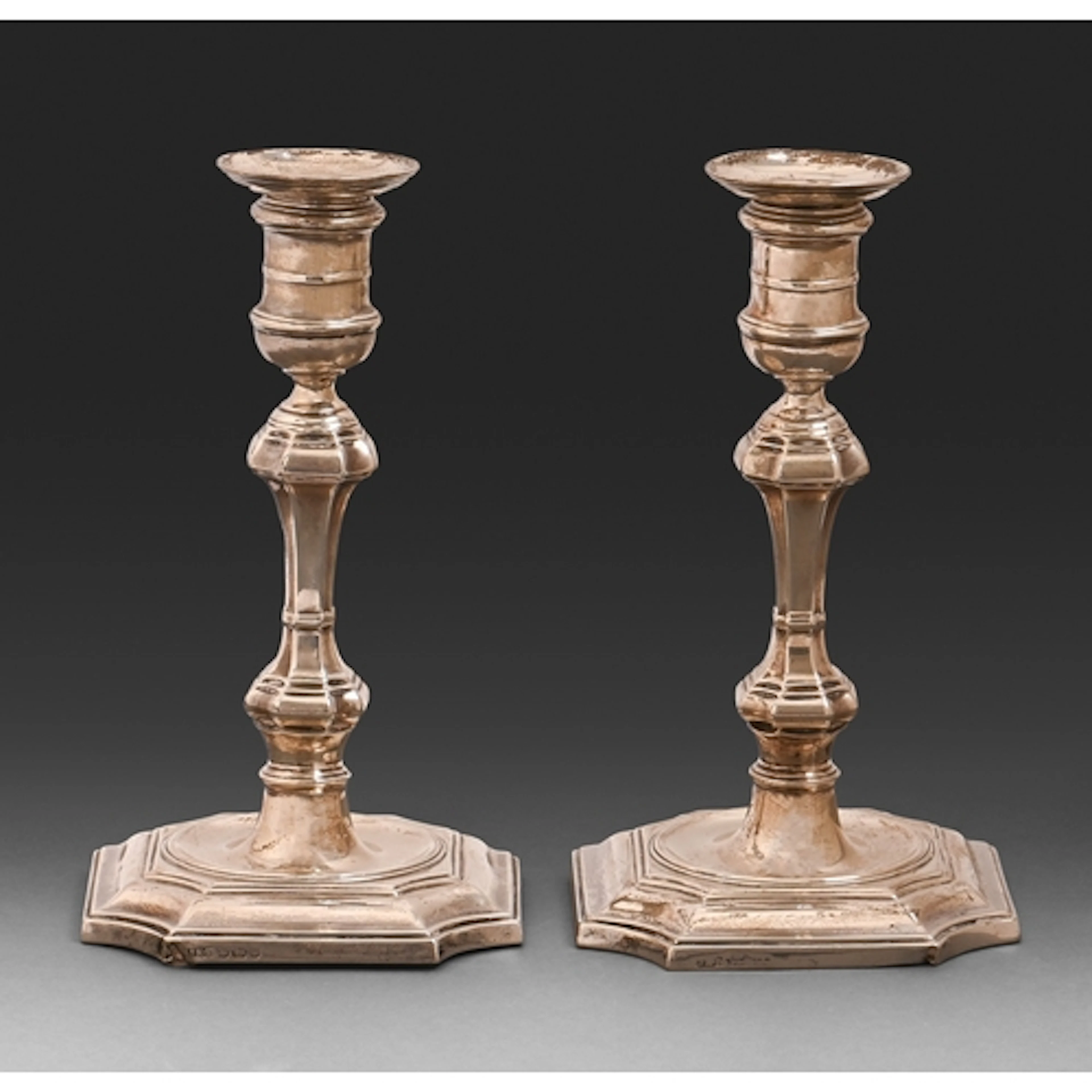 A pair of Victorian silver candlesticks, in mid 18th c Engli...