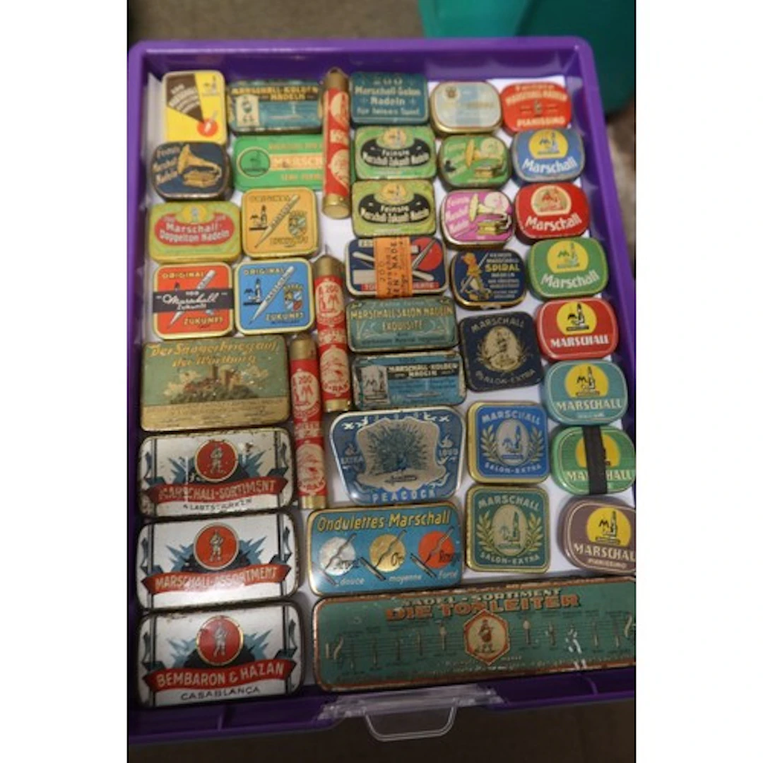 A tray of vintage gramophone needle tins