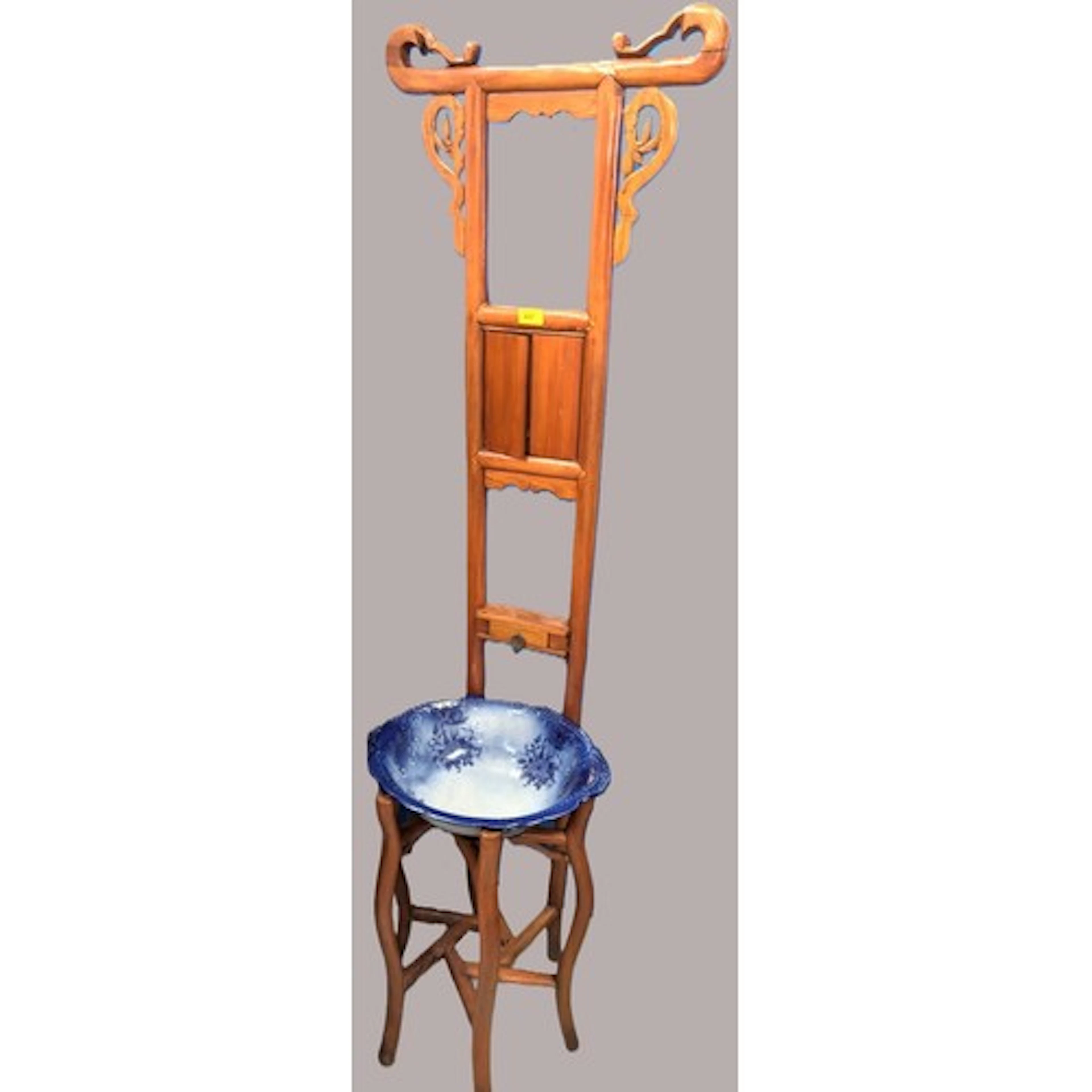 A Chinese 19th century elm shaving stand, height 172cm, late...