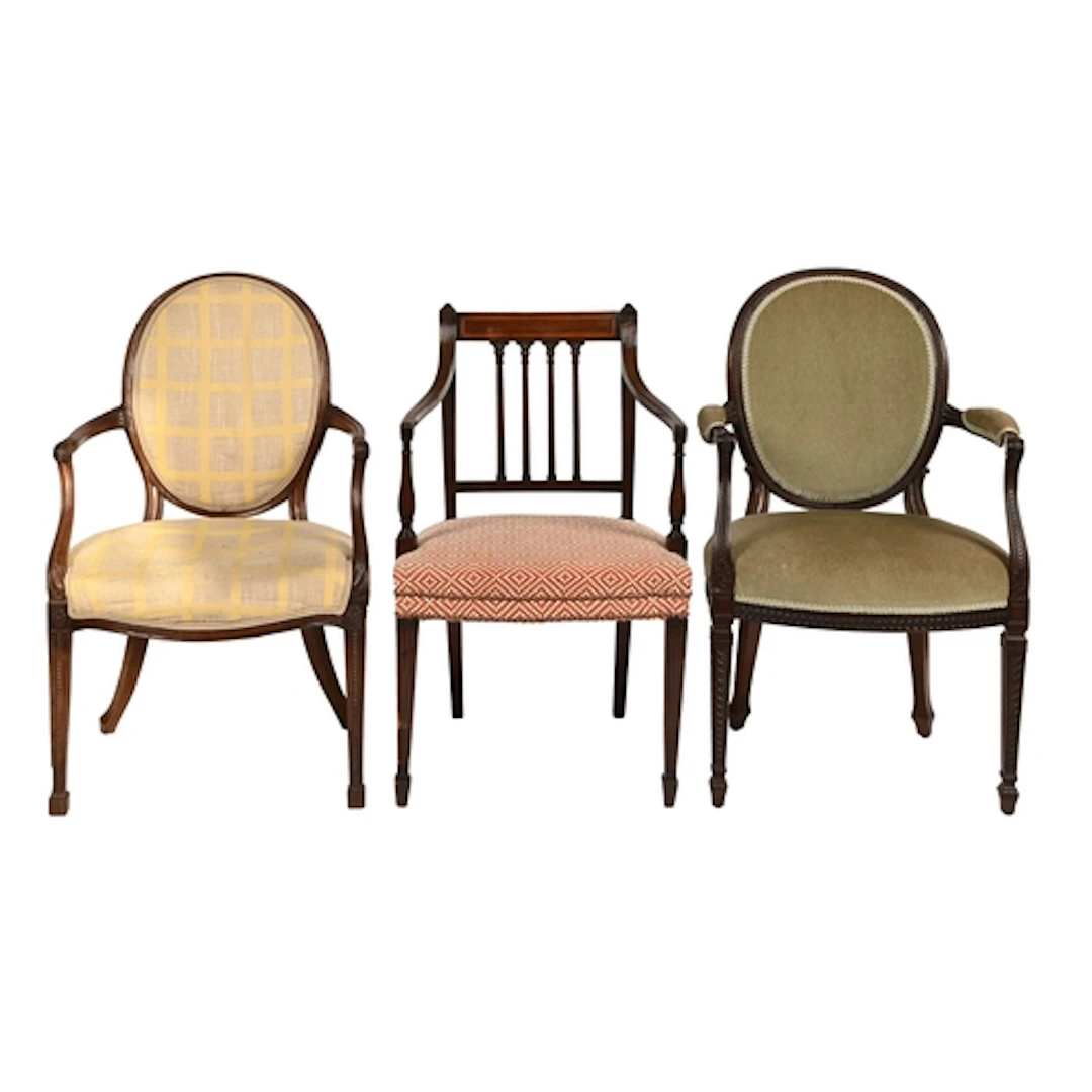 Two George III mahogany elbow chairs, with padded oval back,...
