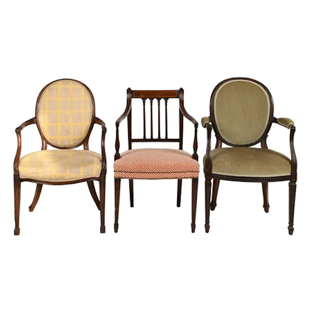 Two George III mahogany elbow chairs, with padded oval back,...