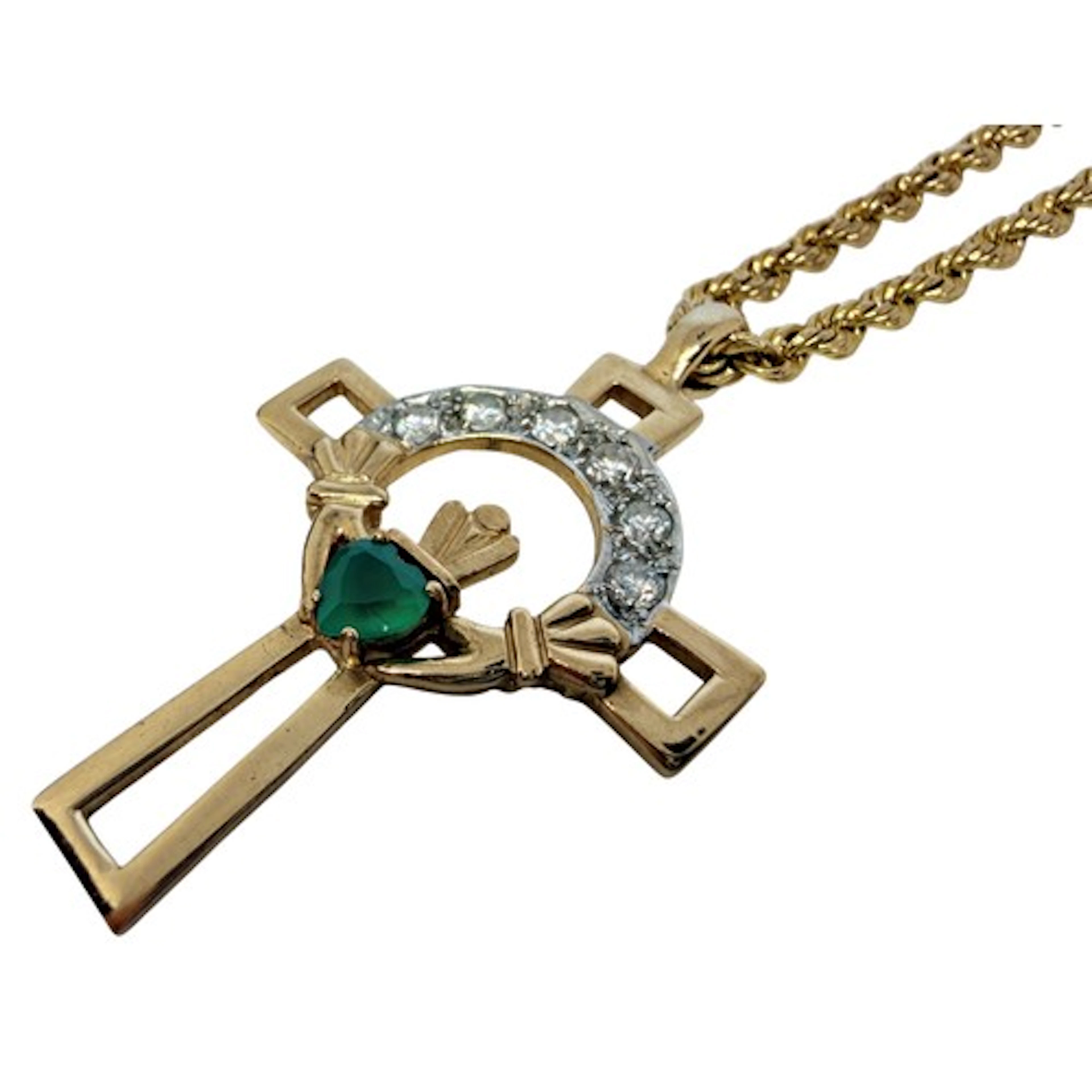 An open-worked crucifix pendant, centred with a stylised cla...