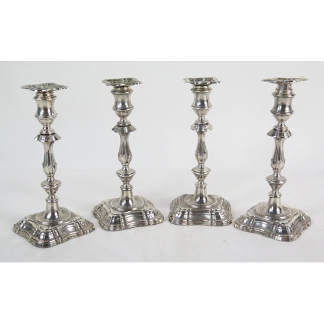A set of four Edward VII silver candlesticks in the Georgian...