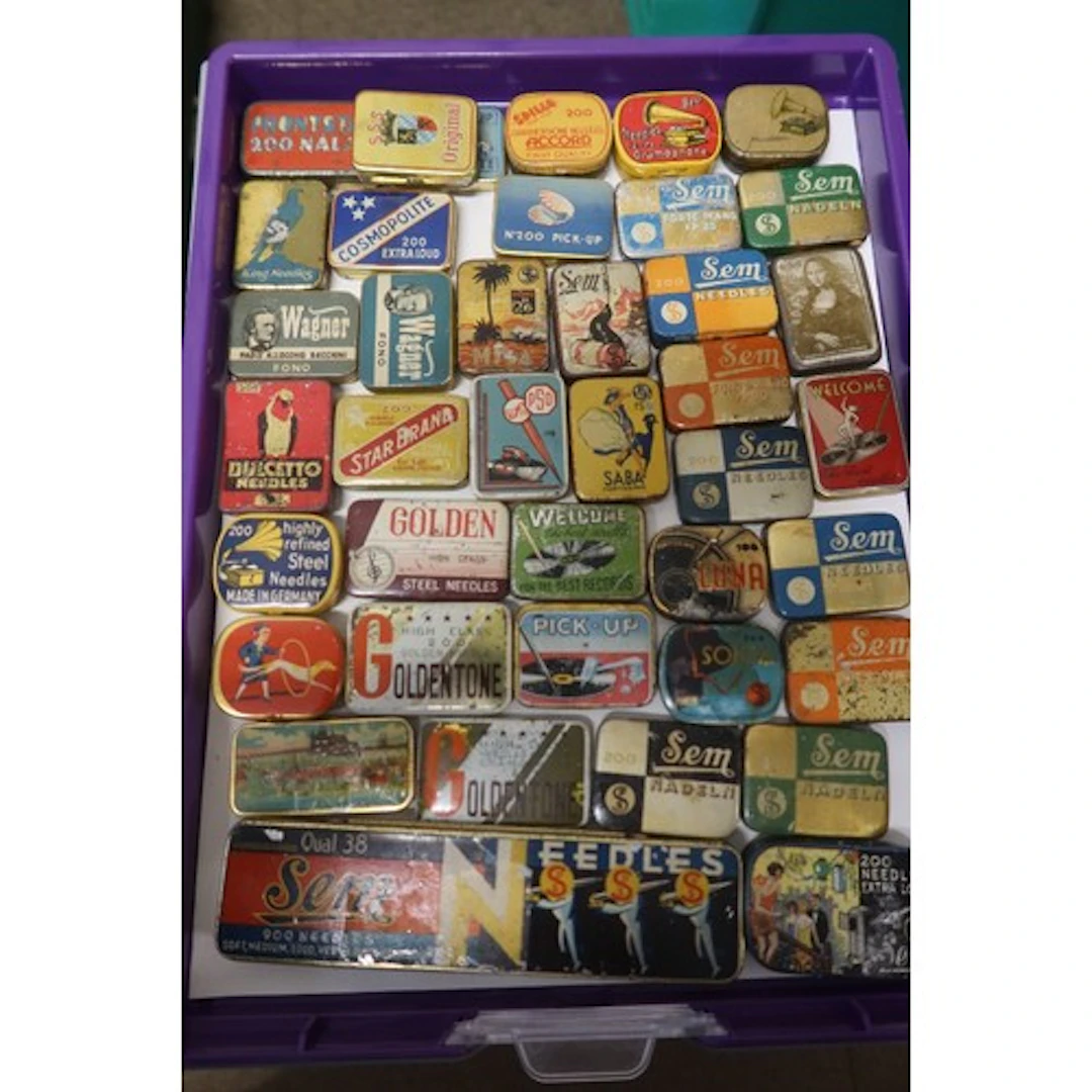 A tray of vintage gramophone needle tins