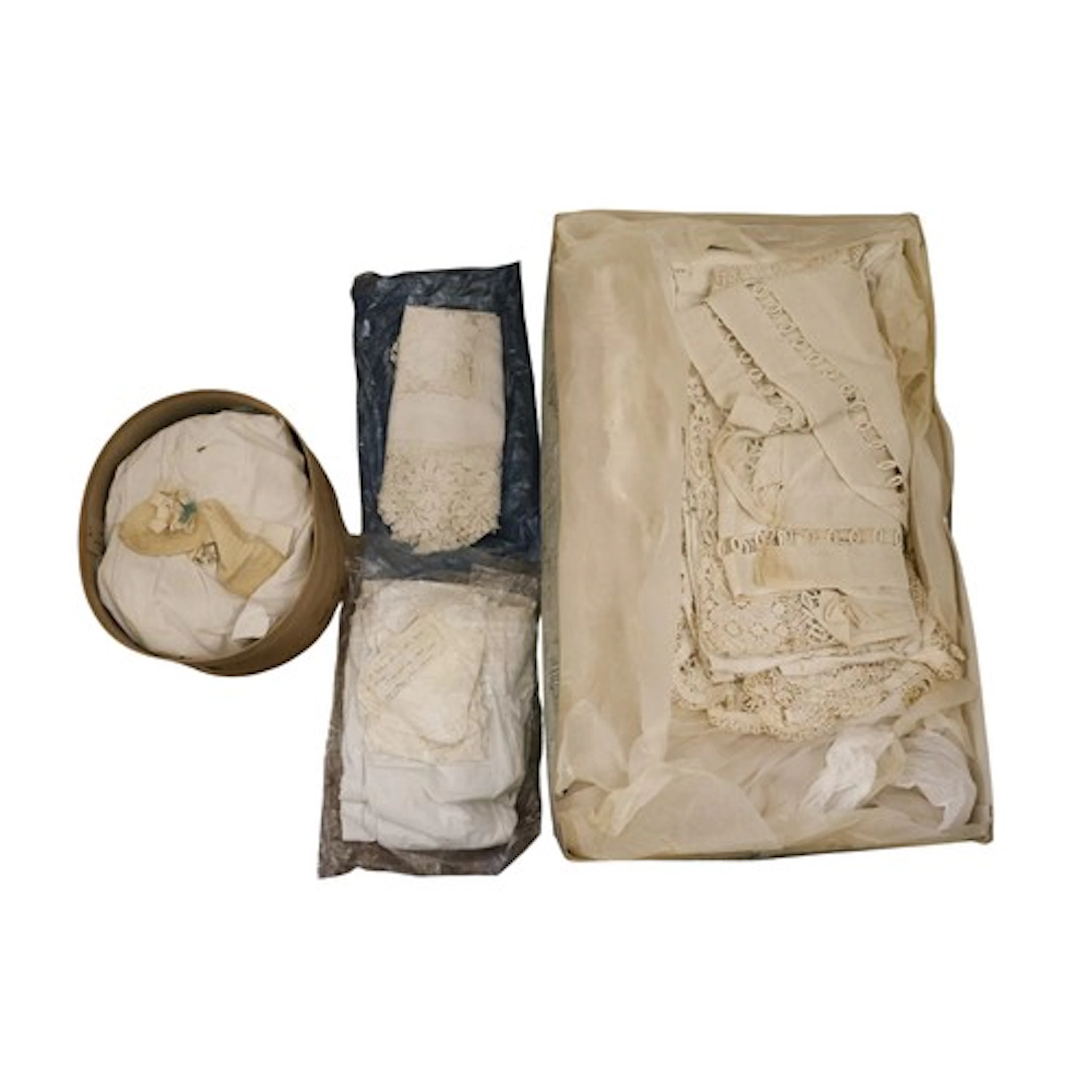 A vintage Harrods box containing a vintage wedding dress and...