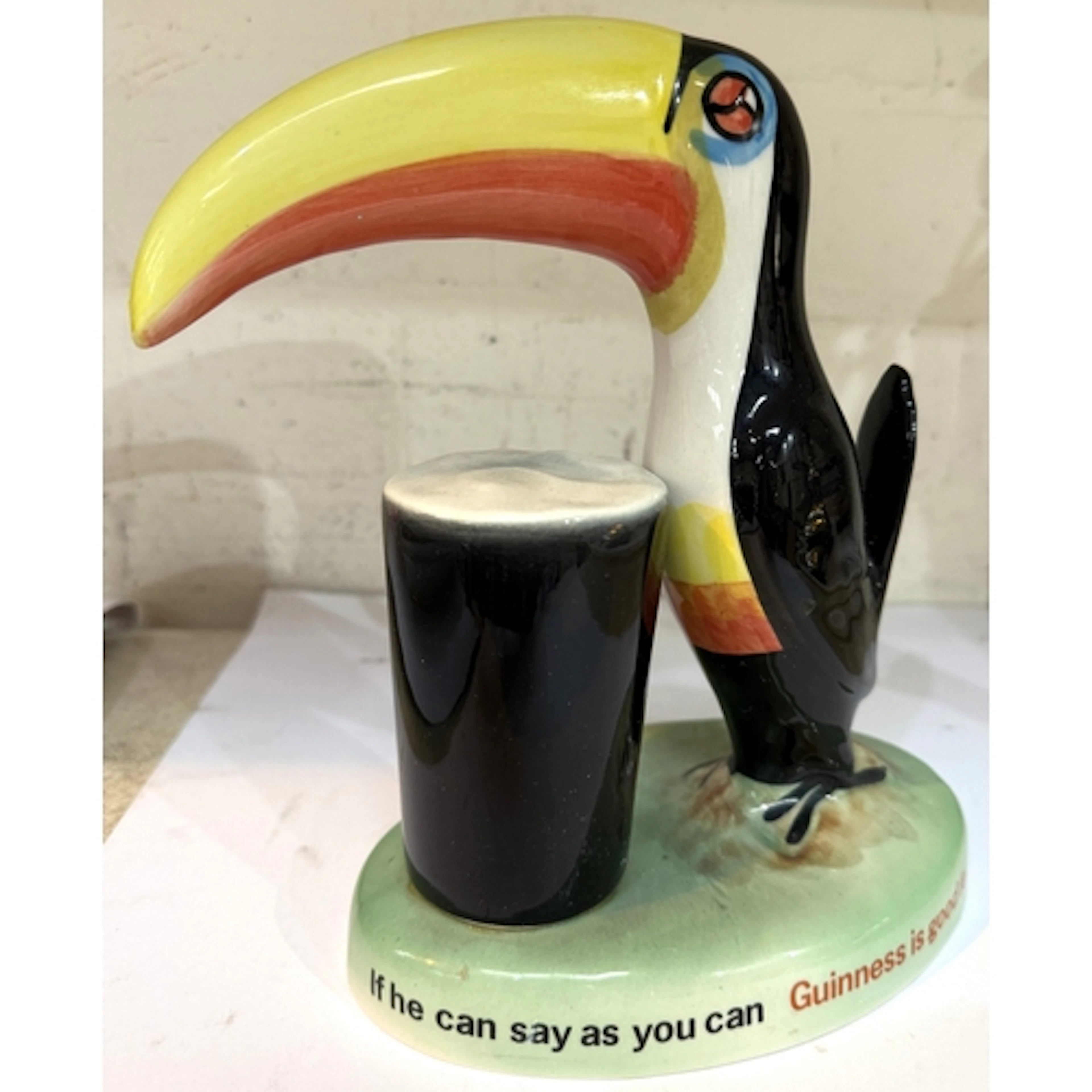 A Carlton ware Guinness Toucan lamp base on green base, blac...