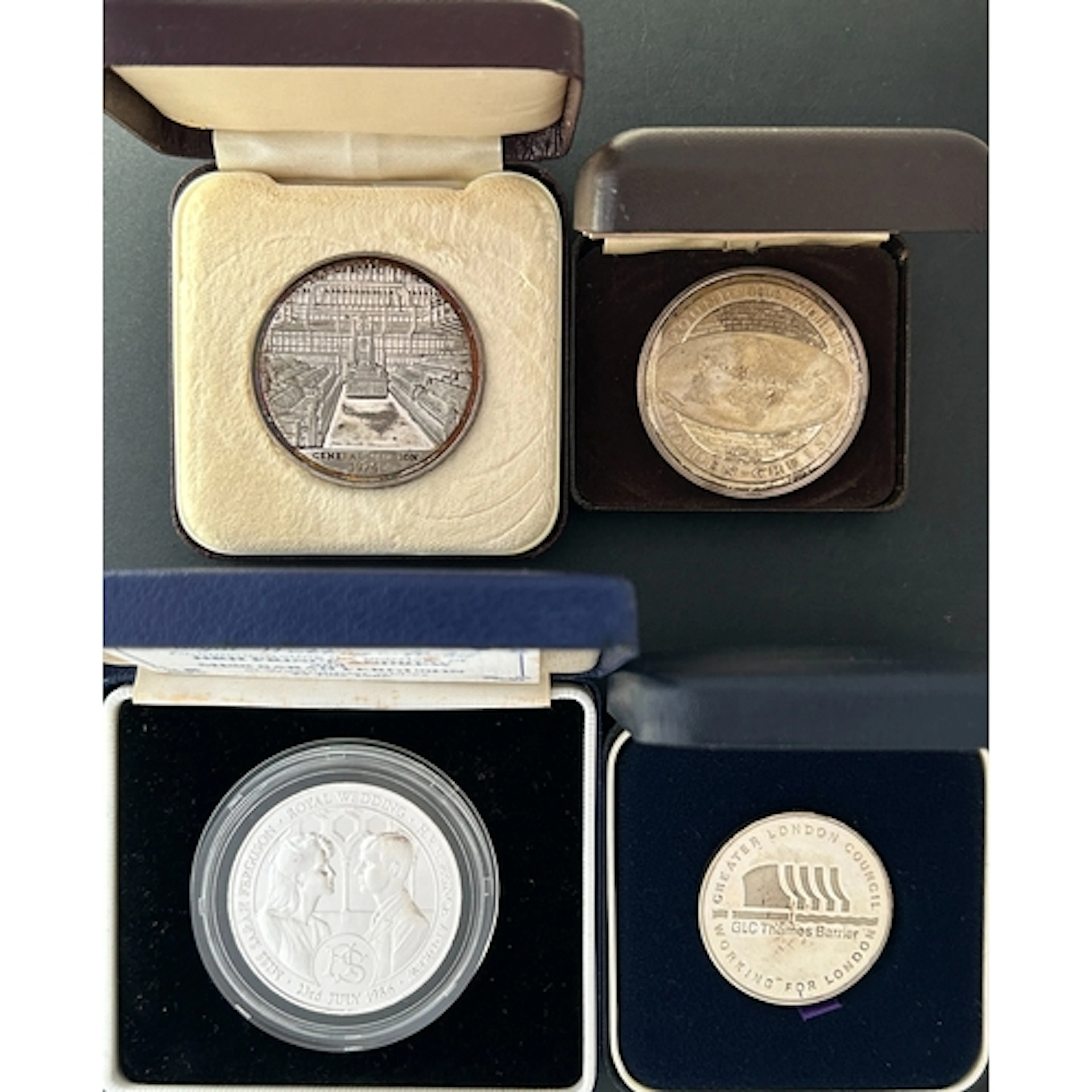 A group of four British silver commemorative medallions, com...