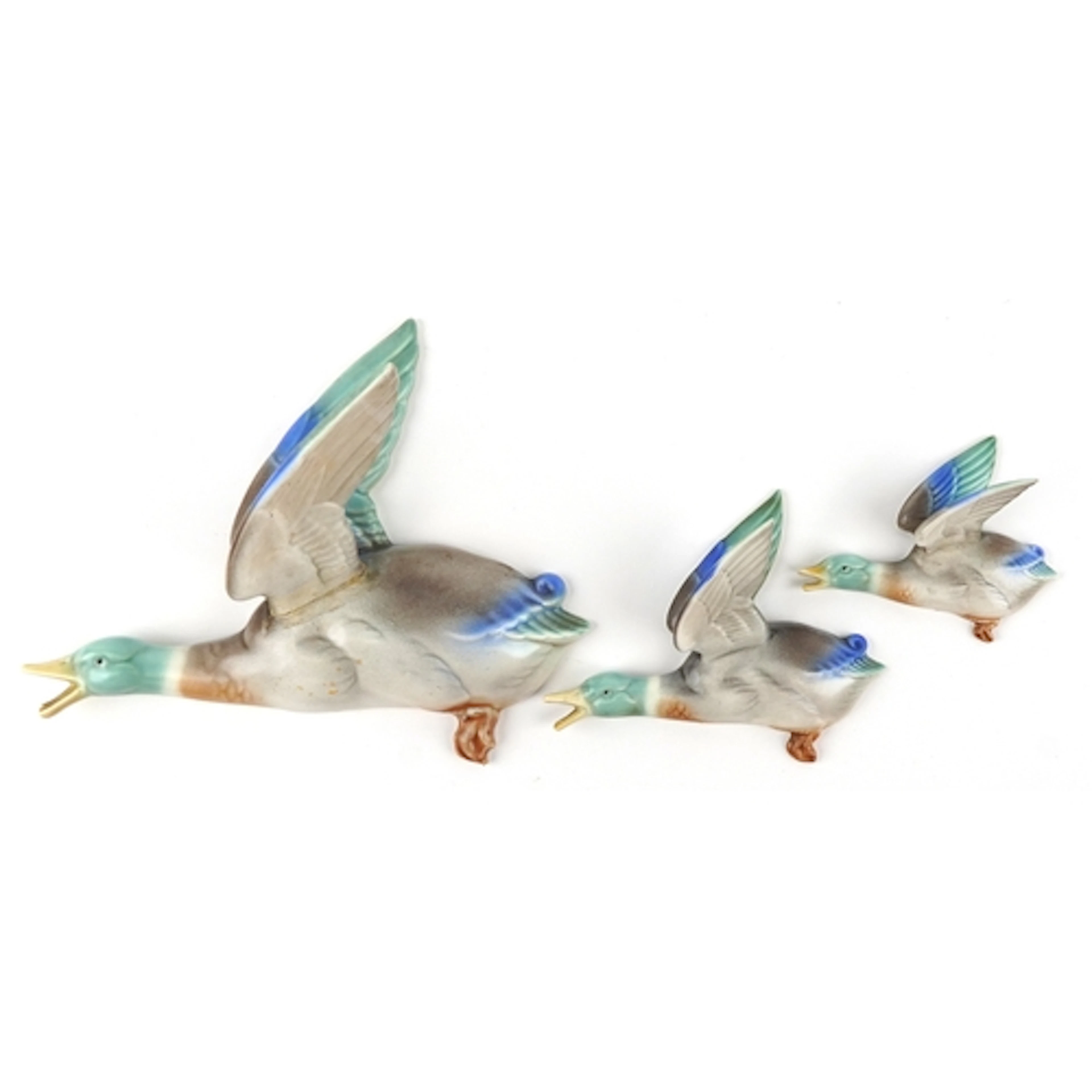 Graduated set of three Poole pottery duck wall plaques, the ...