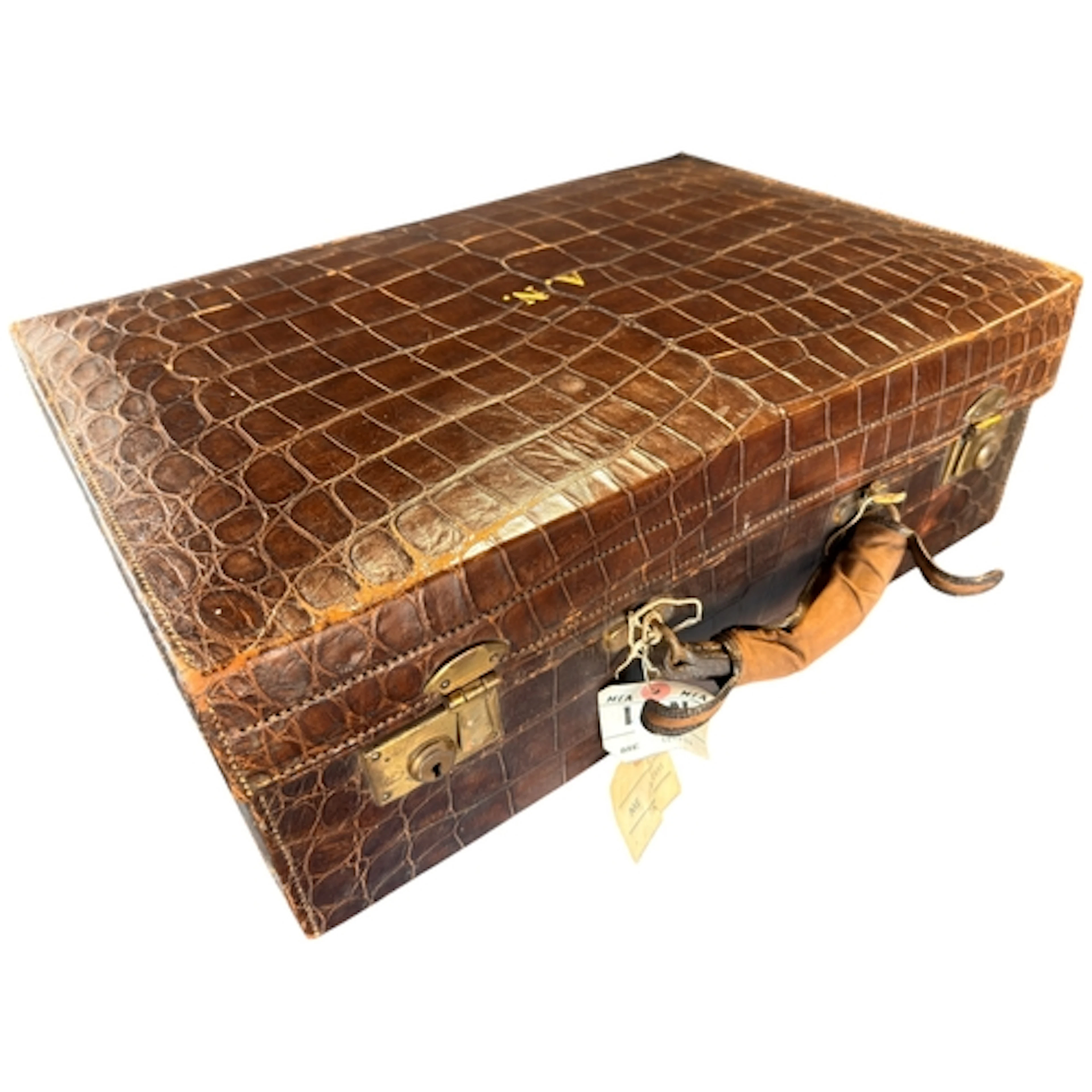An early 20th century crocodile skin suitcase and outer case...