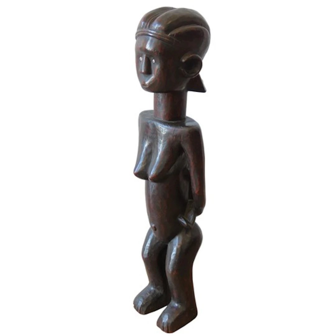 A LARGE AFRICAN FEMALE FERTILITY FIGURE with an infant on he...