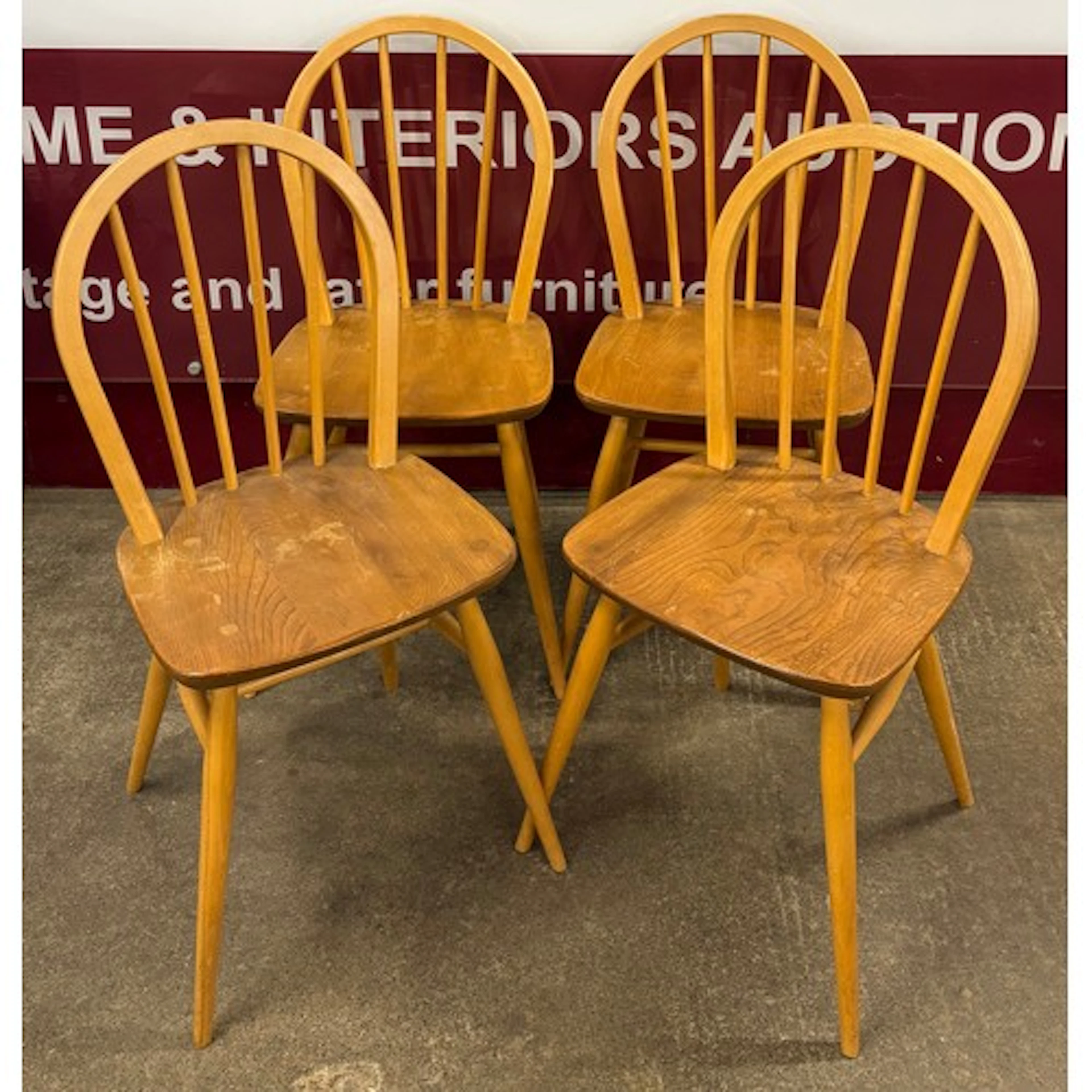 A set of four Ercol Blonde elm and beech Windsor chairs
