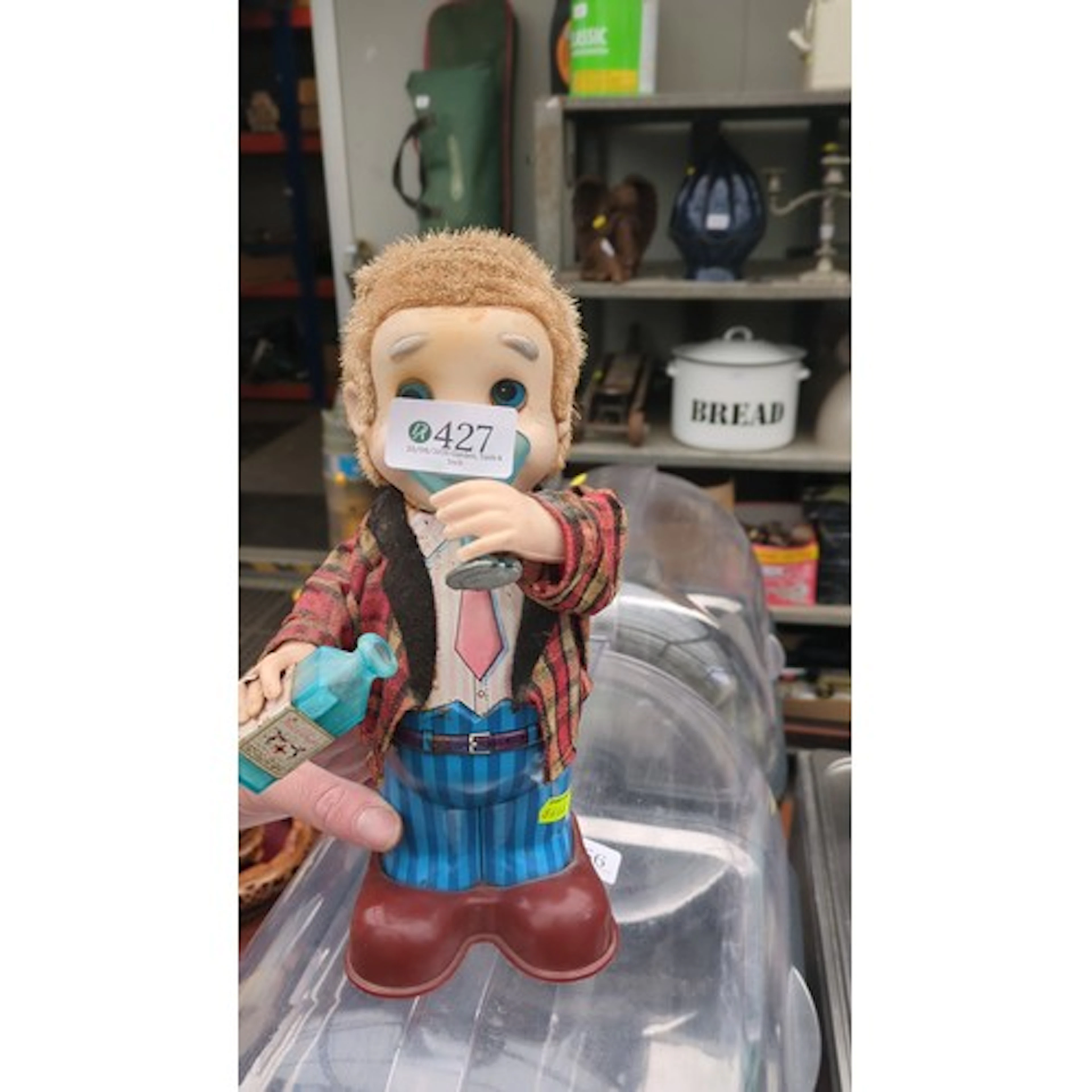Mid-20th-century novelty battery-operated mechanical figure—...