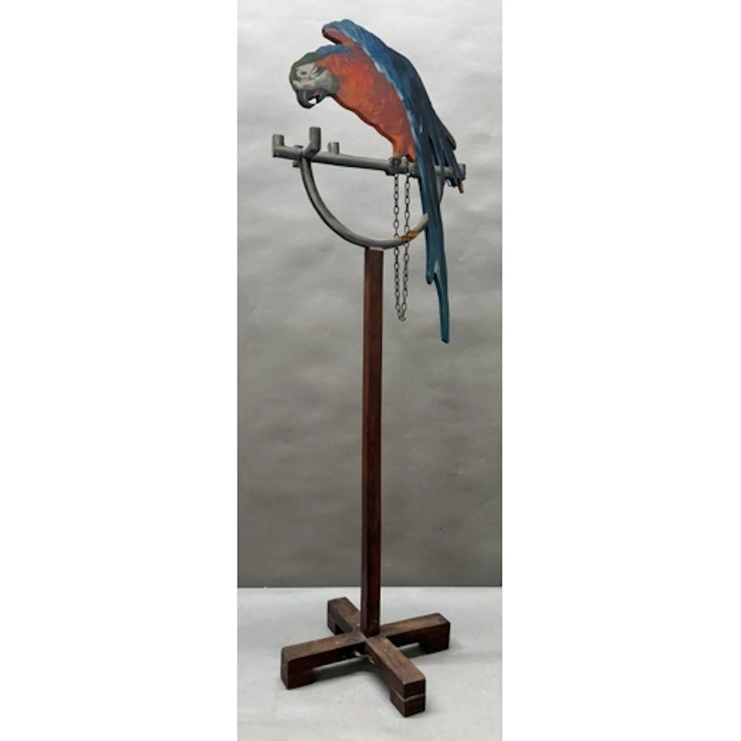 A decorative wooden macaw on stand. Height 90cms.