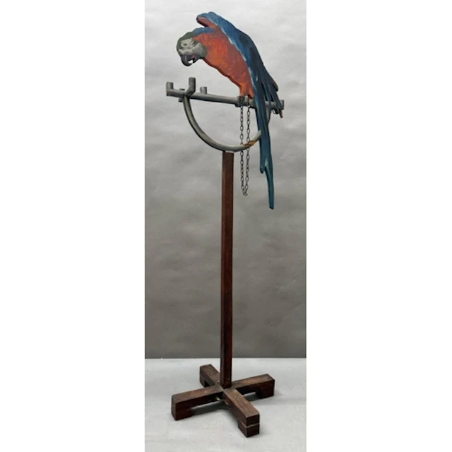 A decorative wooden macaw on stand. Height 90cms.