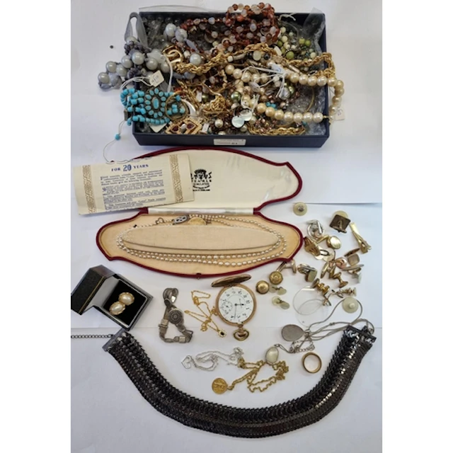 A strong box containing Costume Jewellery and other items in...