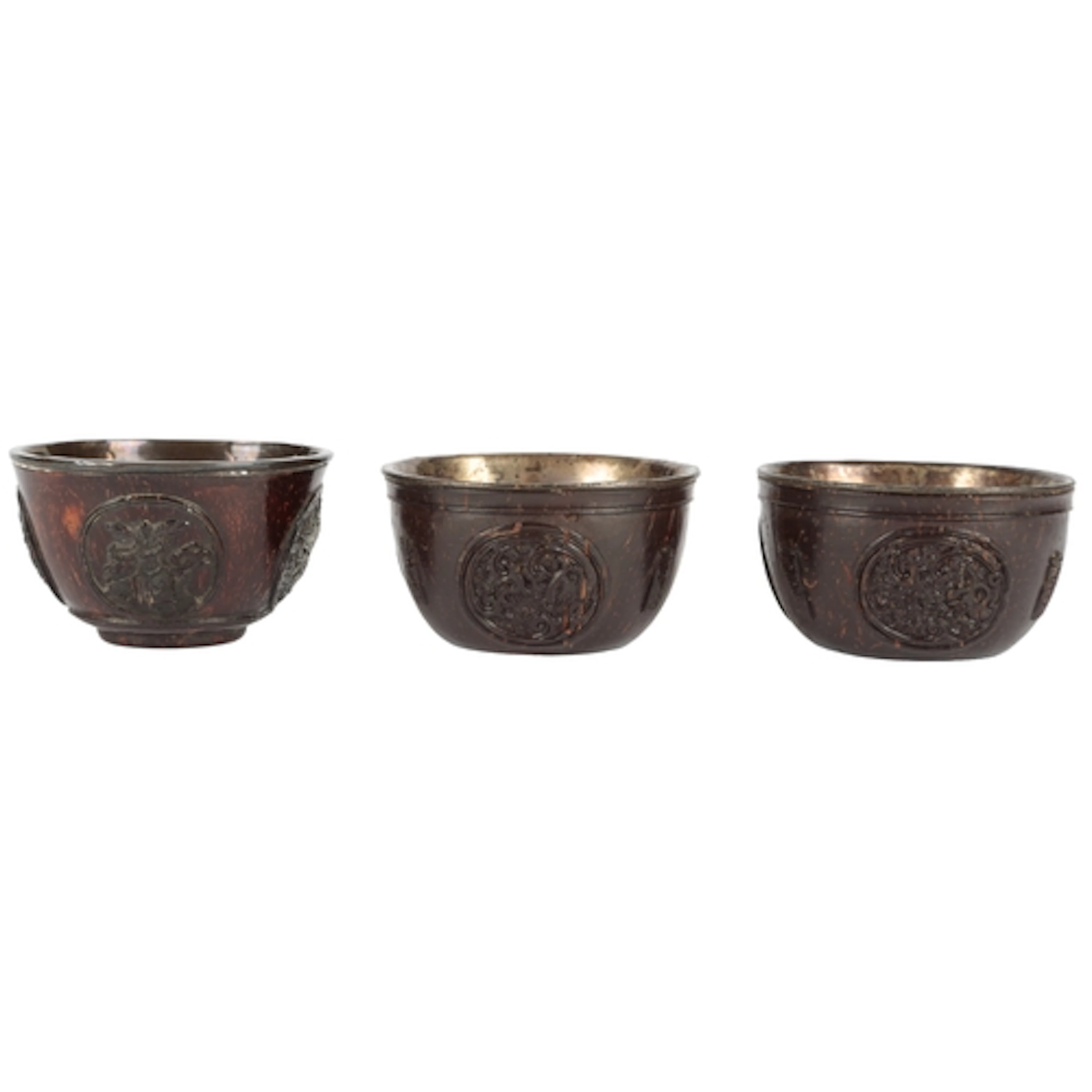 Three Chinese carved coconut 'medallion' cups, first half 19...