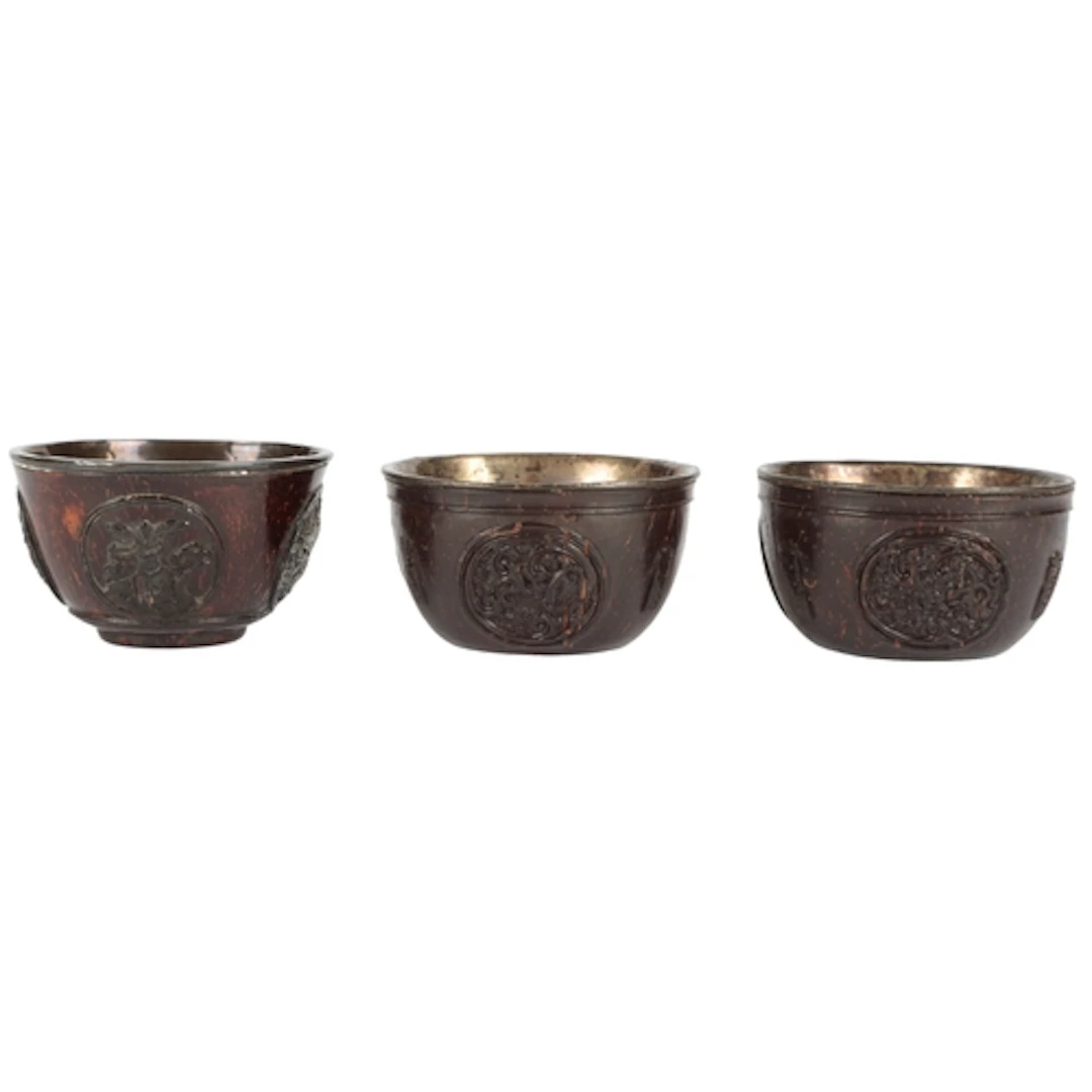 Three Chinese carved coconut 'medallion' cups, first half 19...
