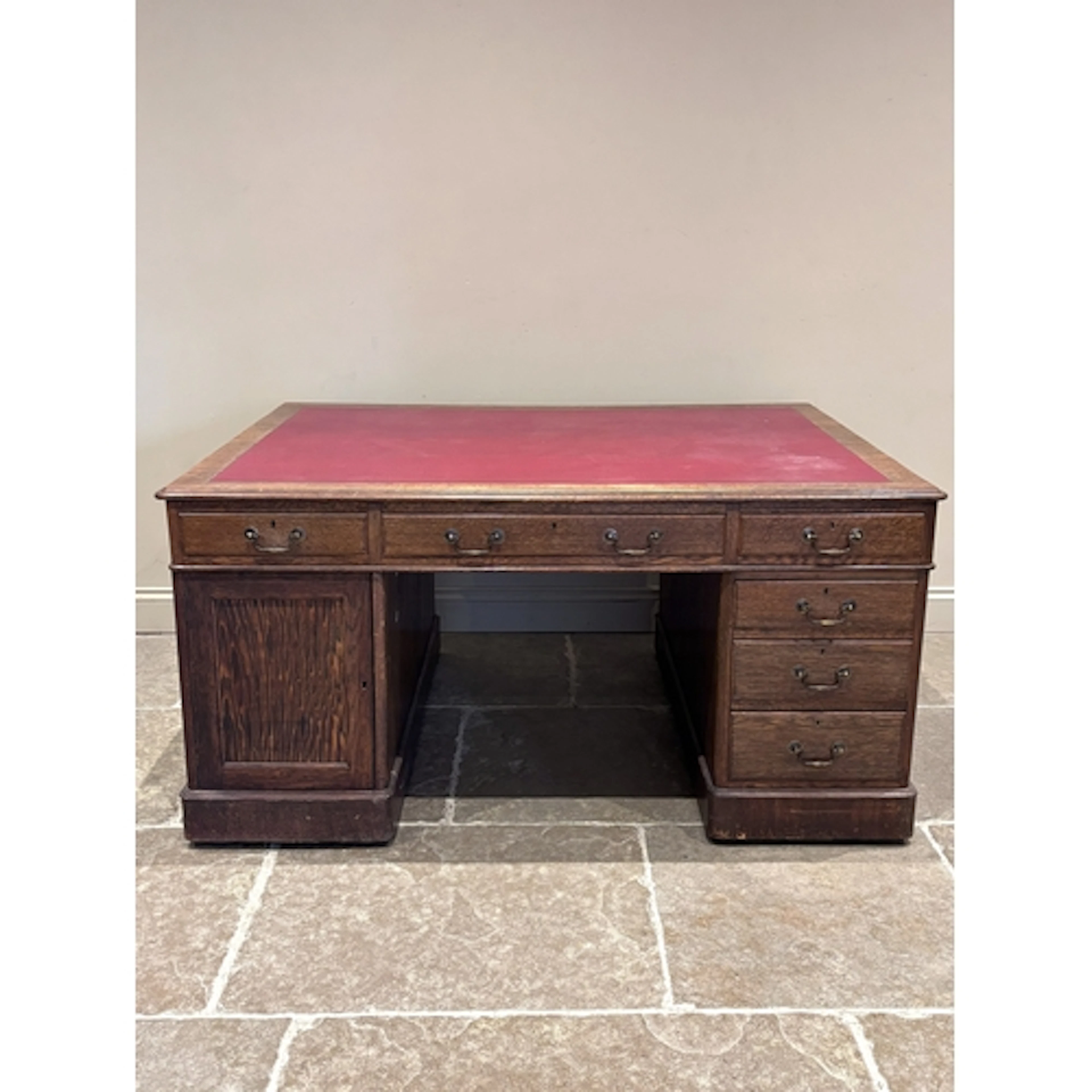A Victorian oak and pedestal partners desk, the rectangular ...