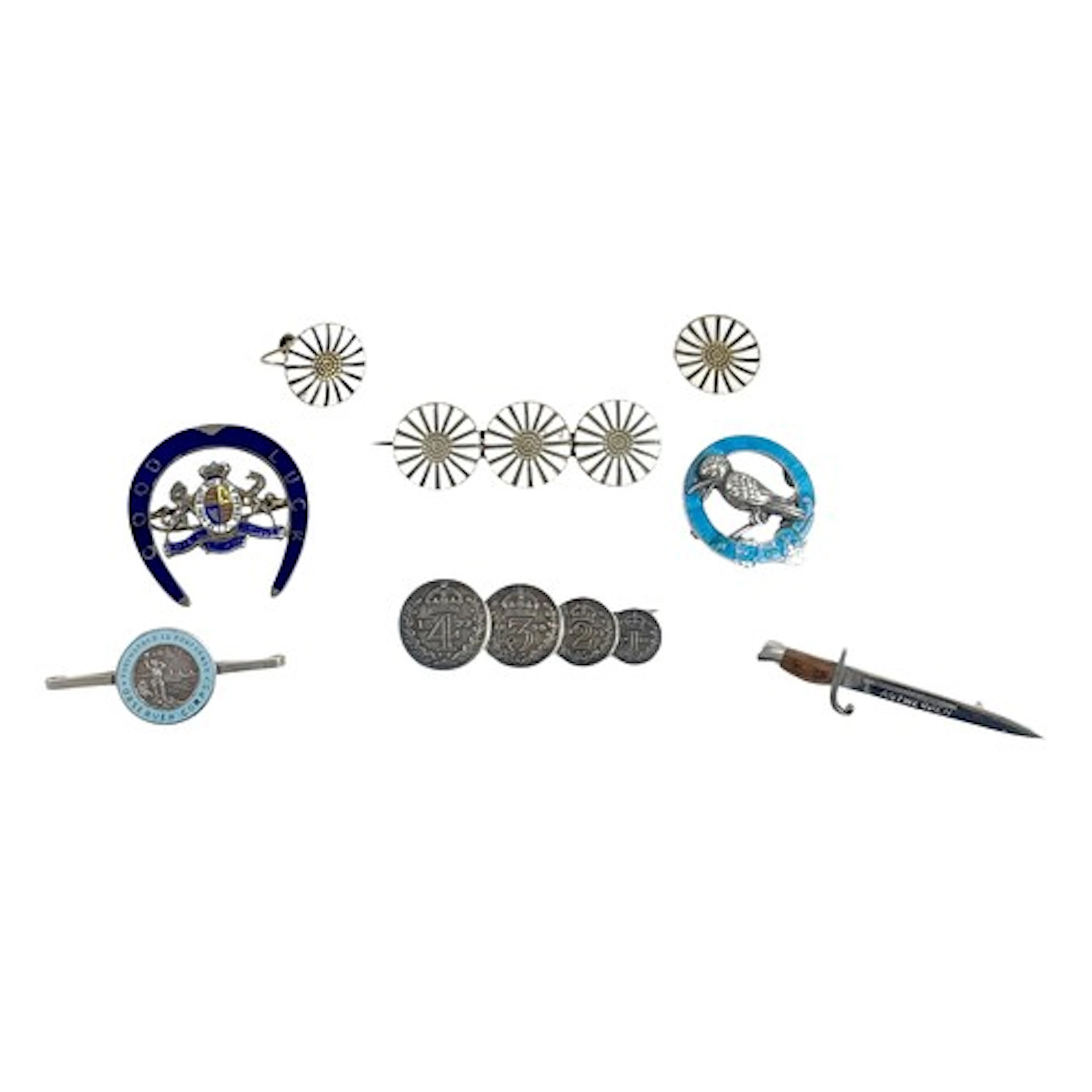 An interesting group of six brooches, comprising a silver an...
