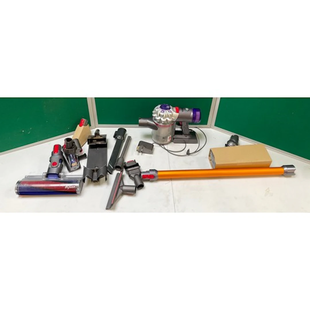 A Dyson V8 Absolute stick vacuum cleaner with charger, origi...