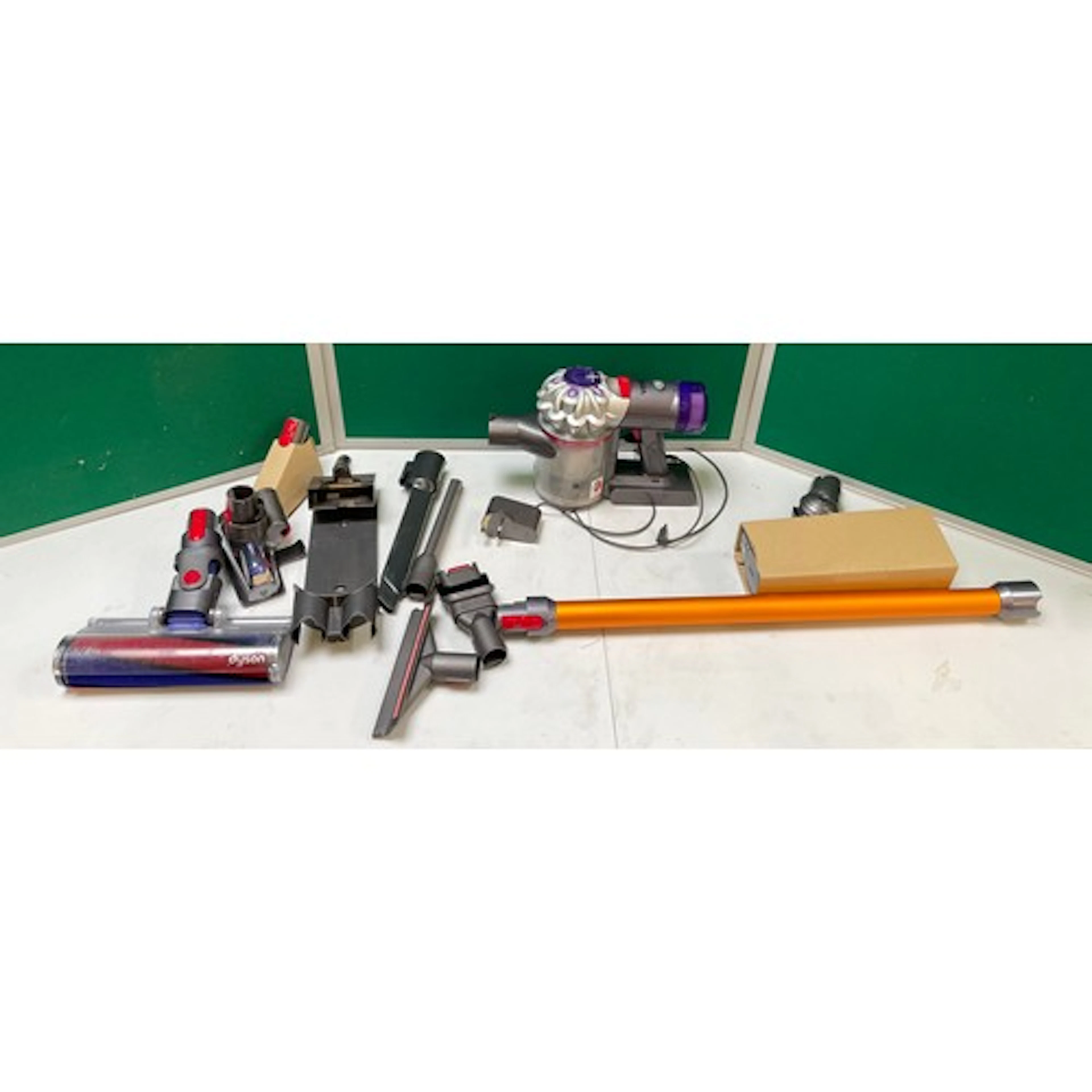 A Dyson V8 Absolute stick vacuum cleaner with charger, origi...