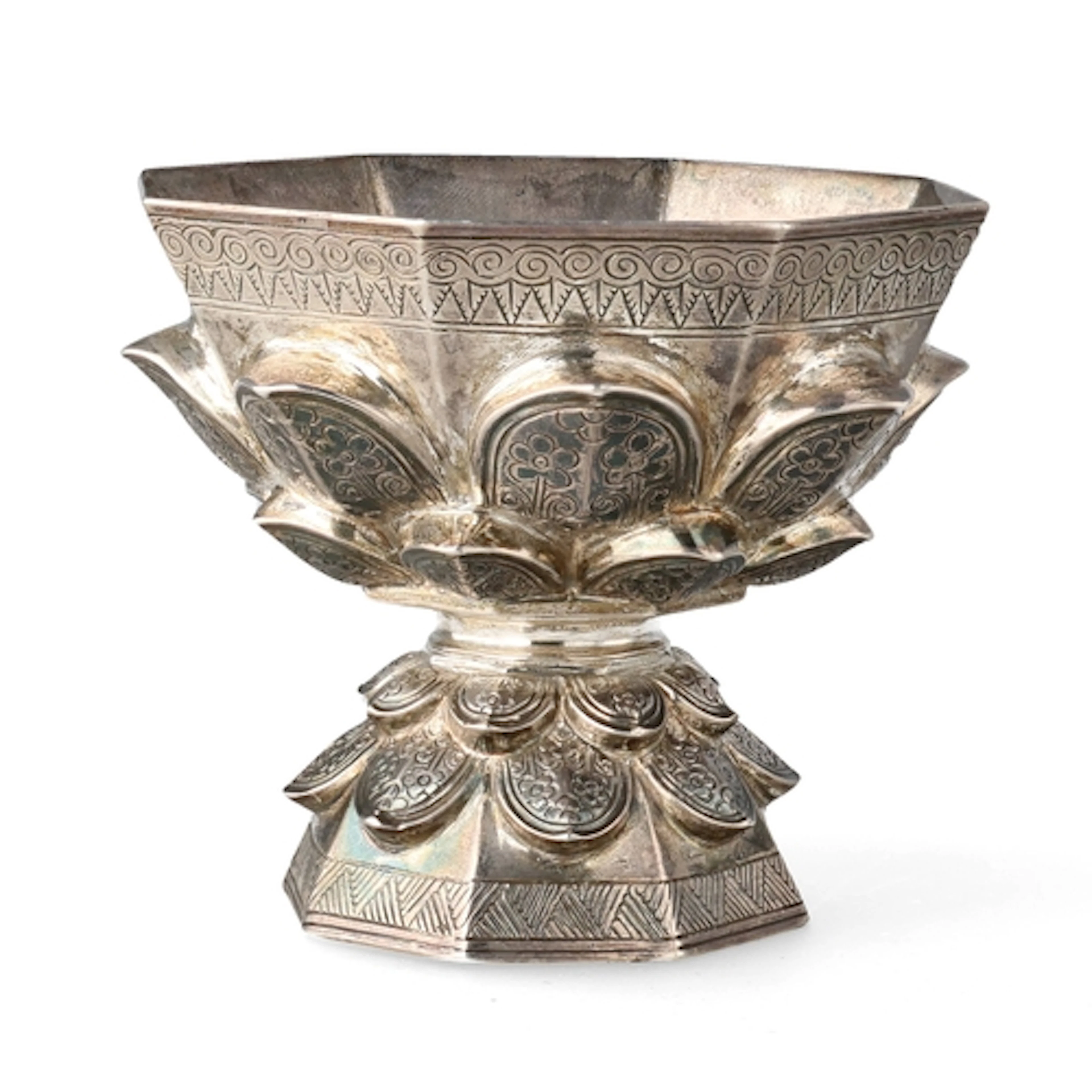 A 20TH C ISLAMIC MALAY SILVER PEDESTAL CUP FORMED AS A LOTUS...