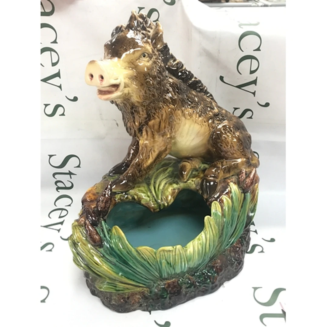 A reproduction french majolica earthenware planter, wild boa...