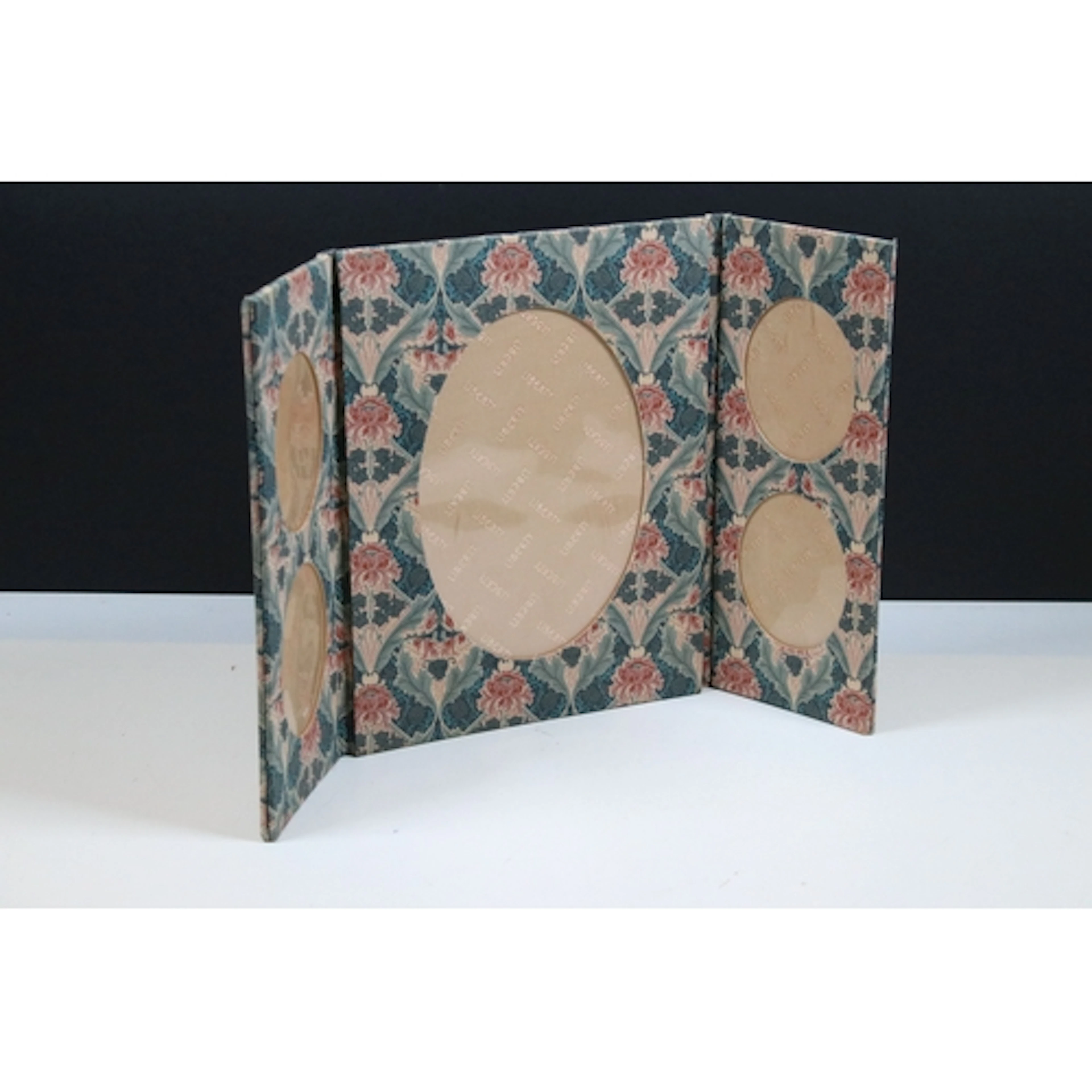 A Liberty Of London folding photograph frame with five oval ...