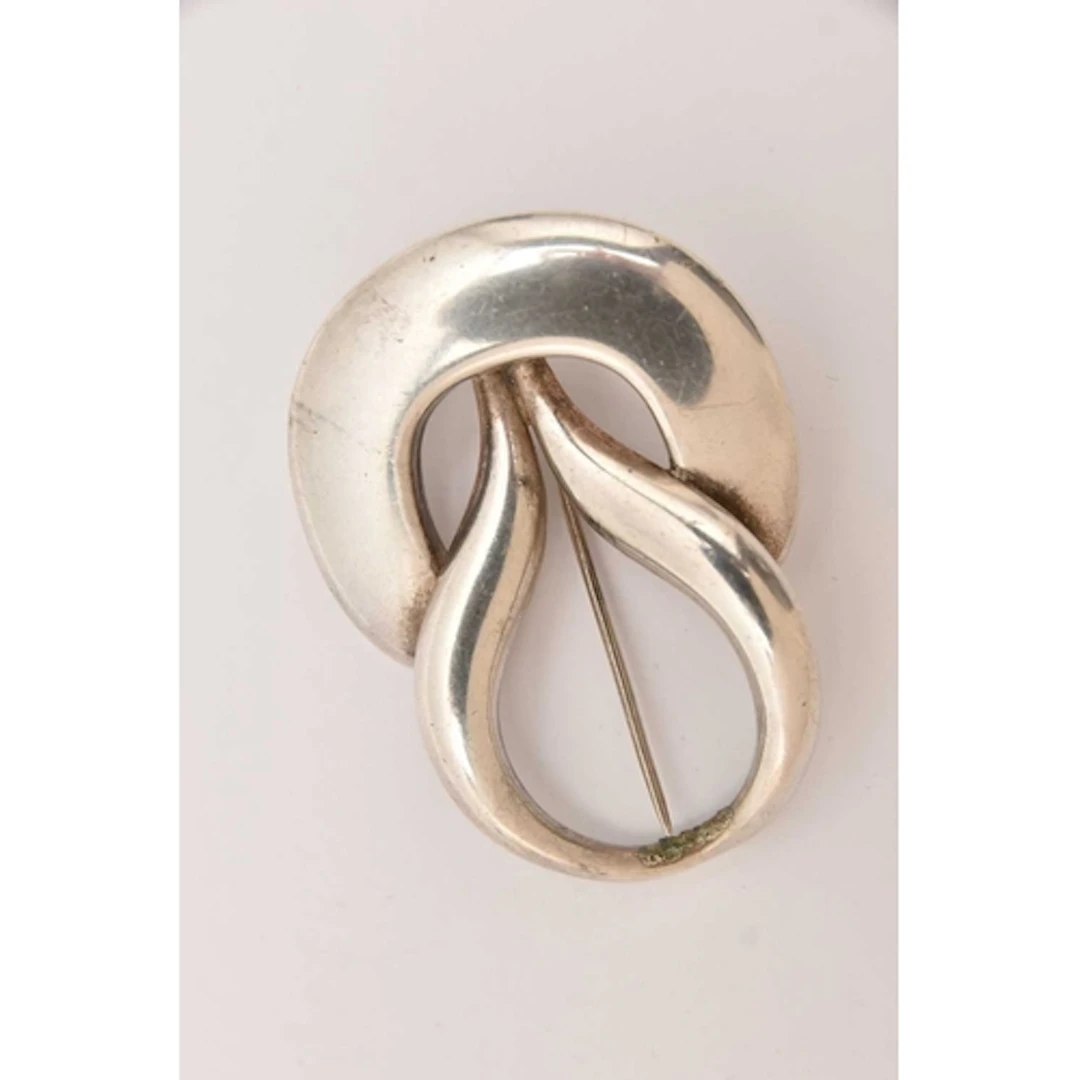 A 'GEORG JENSEN' BROOCH PENDANT, an AF open work knot style ...