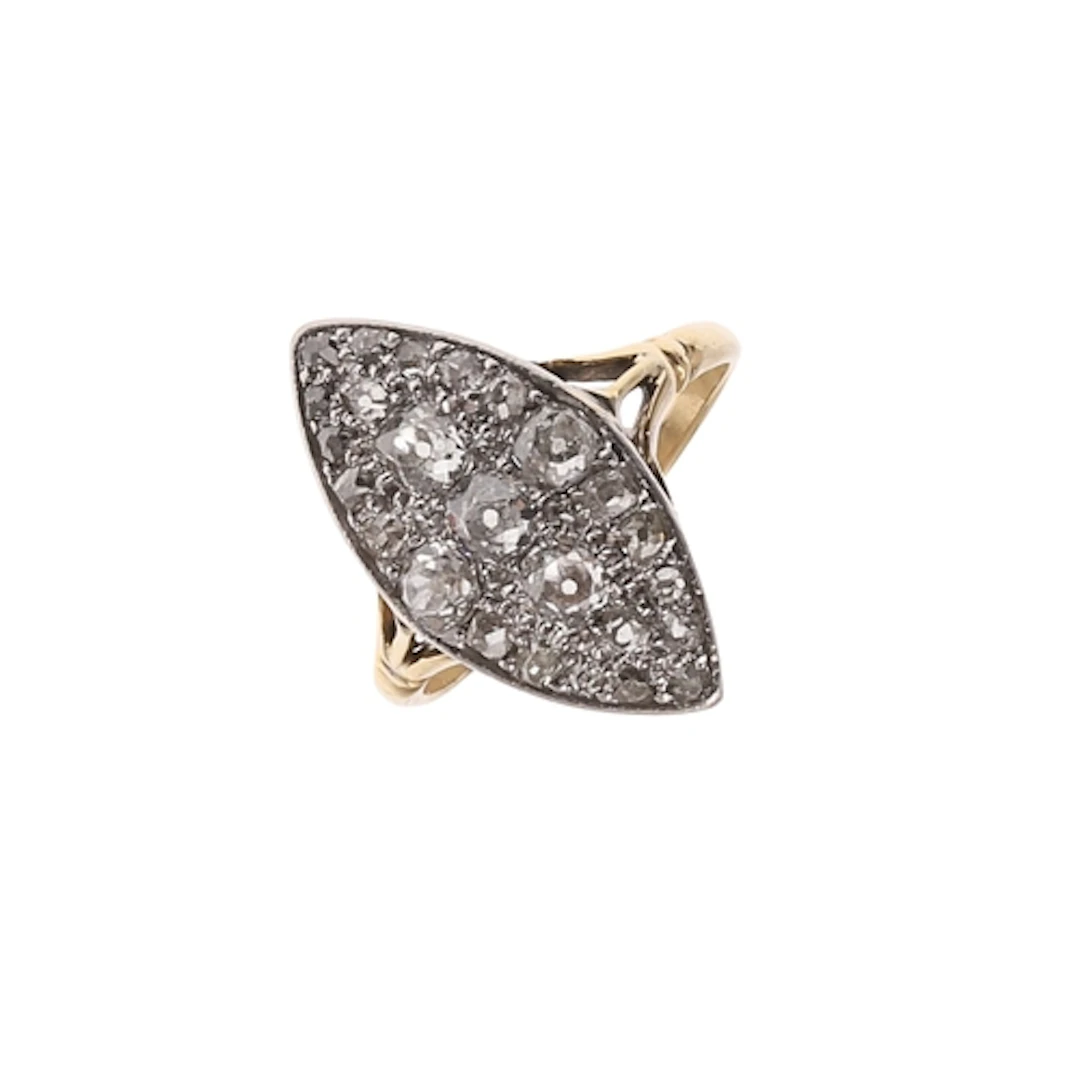 A DIAMOND MARQUISE-SHAPED CLUSTER RING. millegrain set throu...
