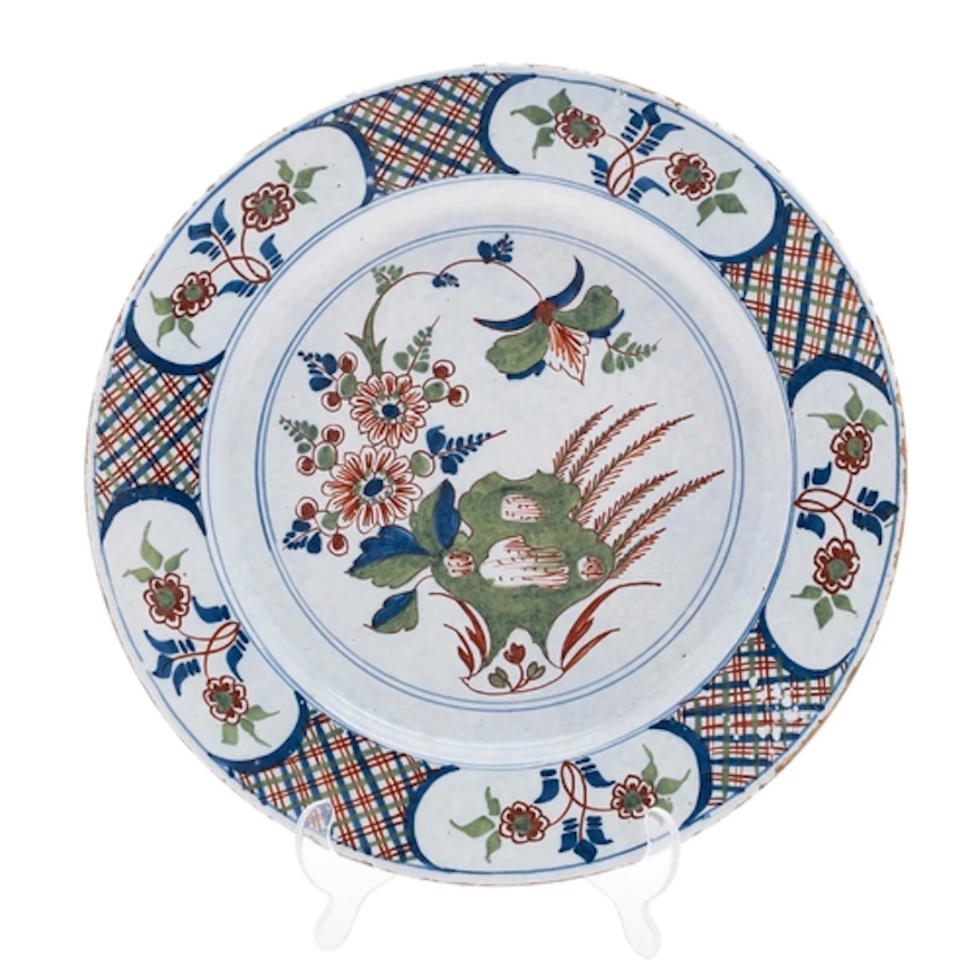 A Bristol polychrome delftware charger, mid 18th century pai...