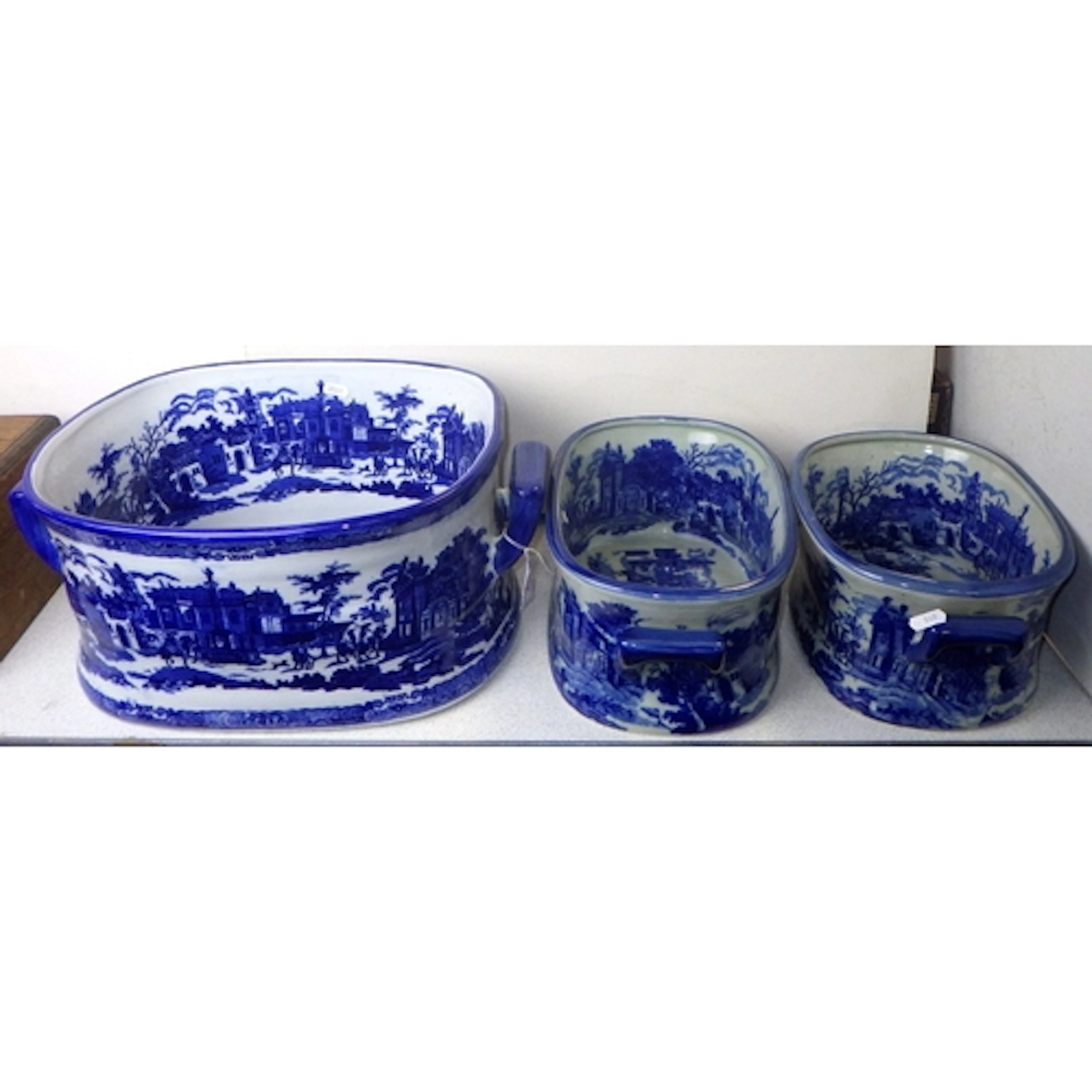 A group of three modern graduated Blue & White footbaths, la...