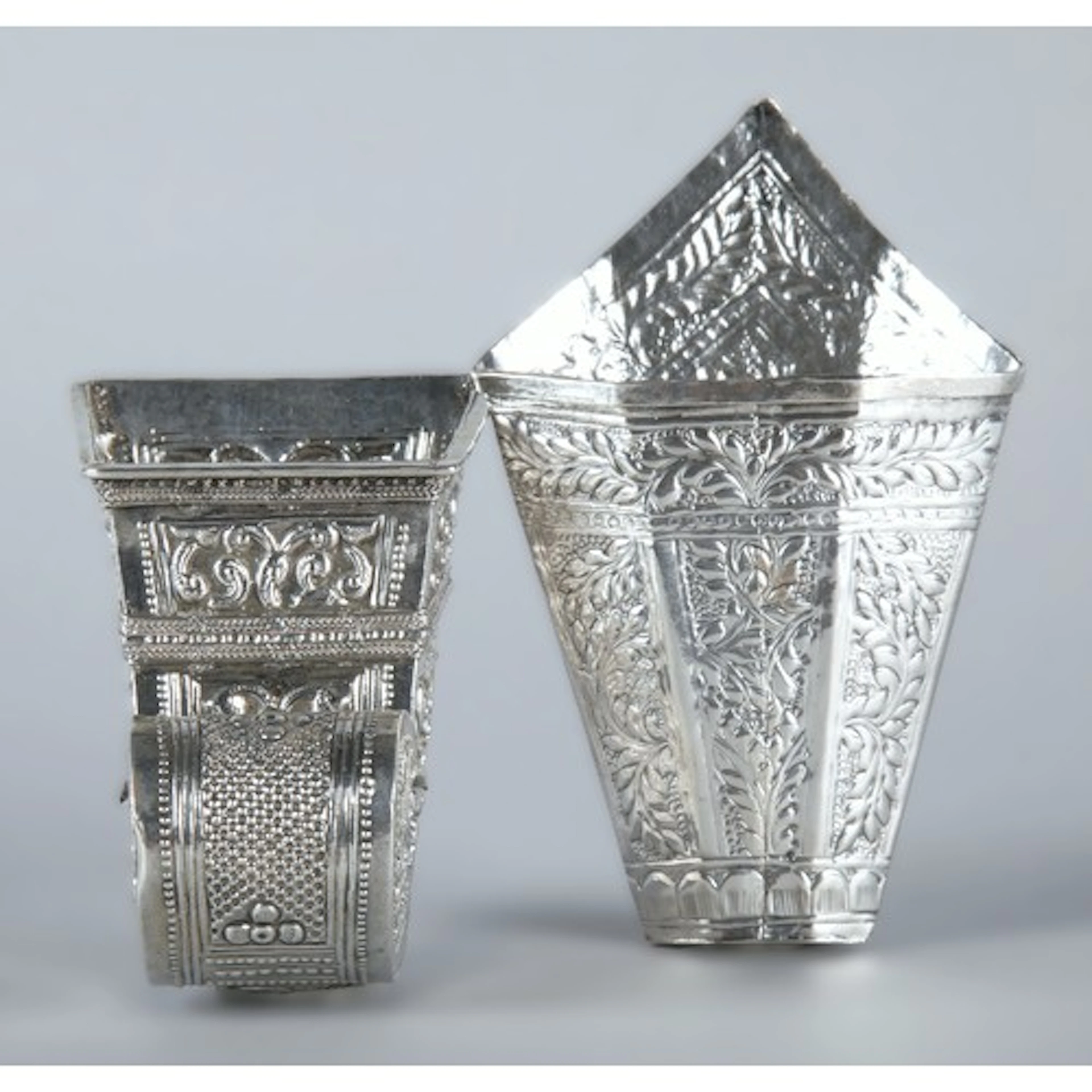 Two Orential silver coloured betel leaf holder's (bekas siri...