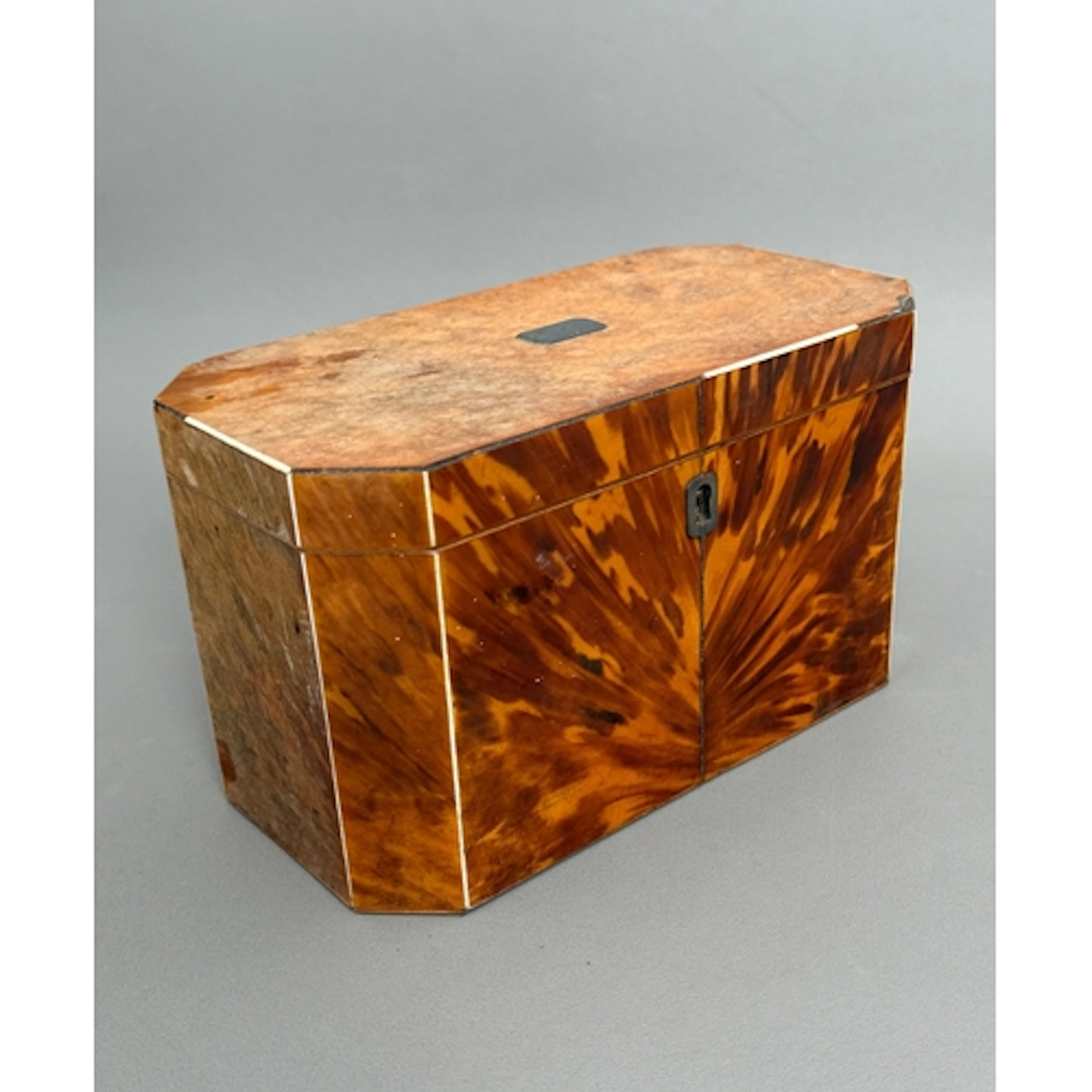A George III blonde tortoiseshell tea caddy - with canted co...