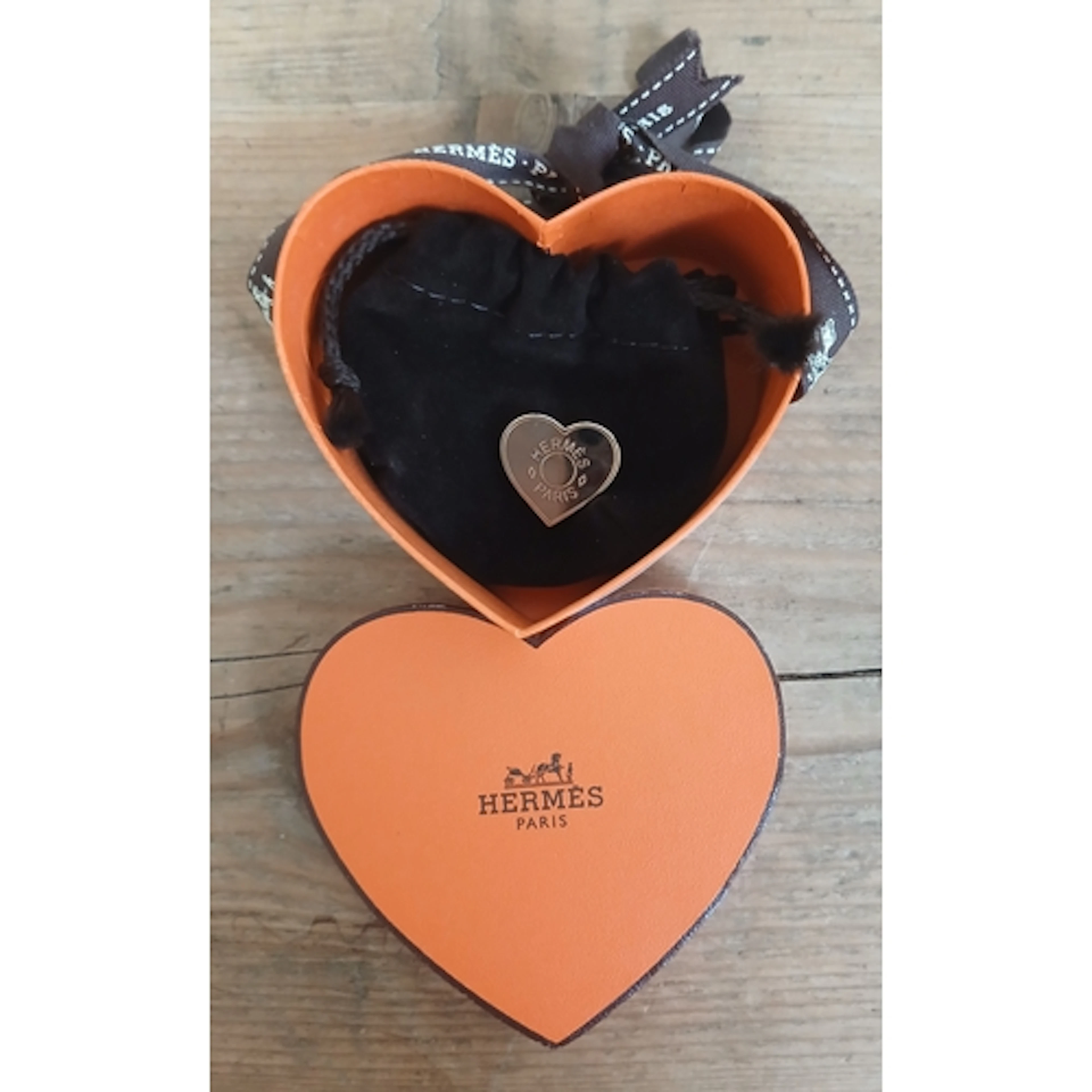HERMES, a heart shaped scarf ring with soft bag and box.