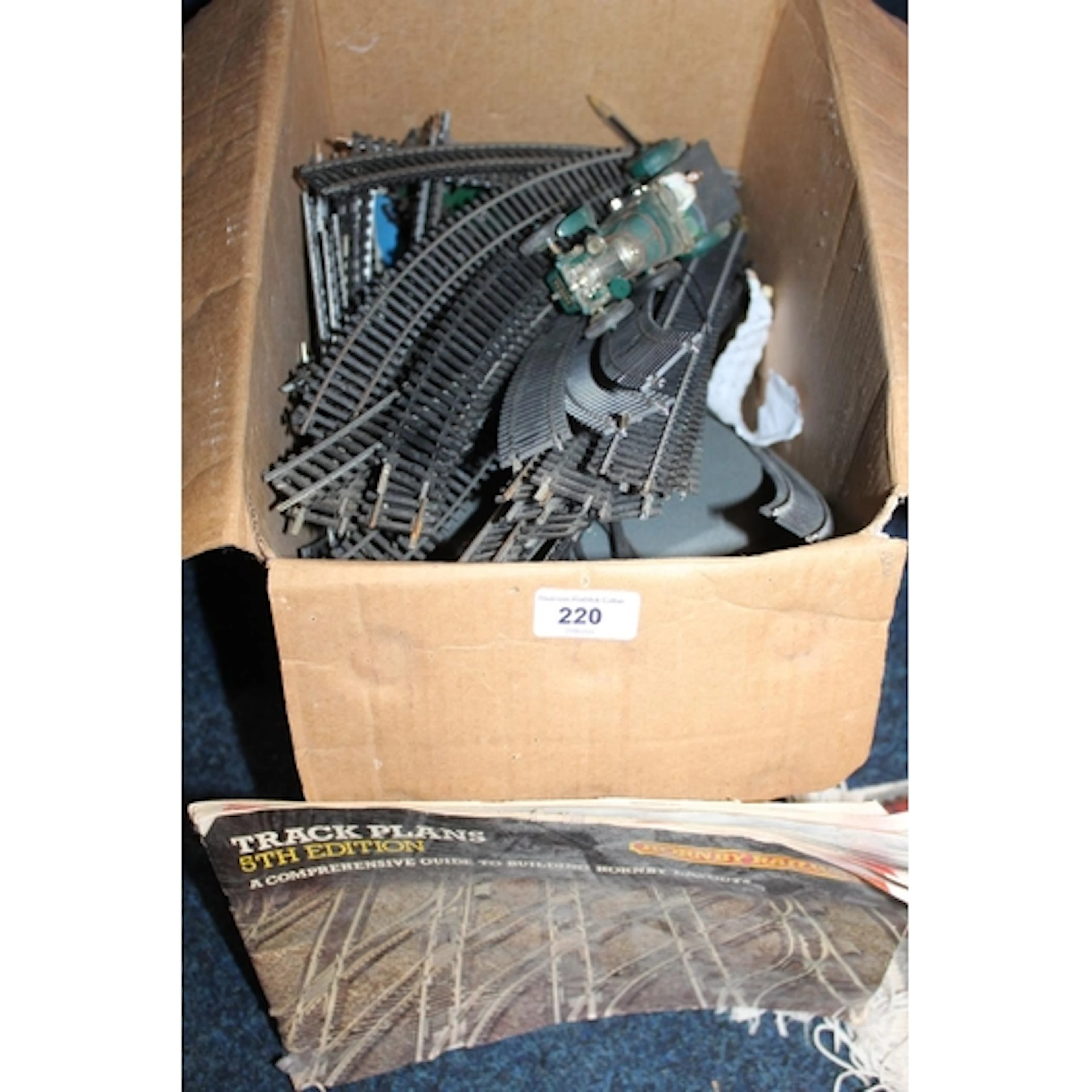 Boxed Hornby railway track, vintage sports car, etc.