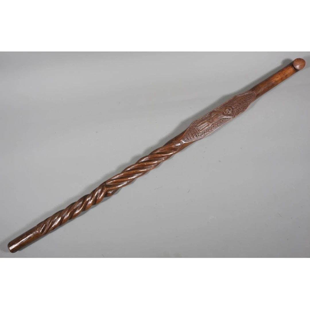 Carved Polynesian stick, the central panel depicting figures...
