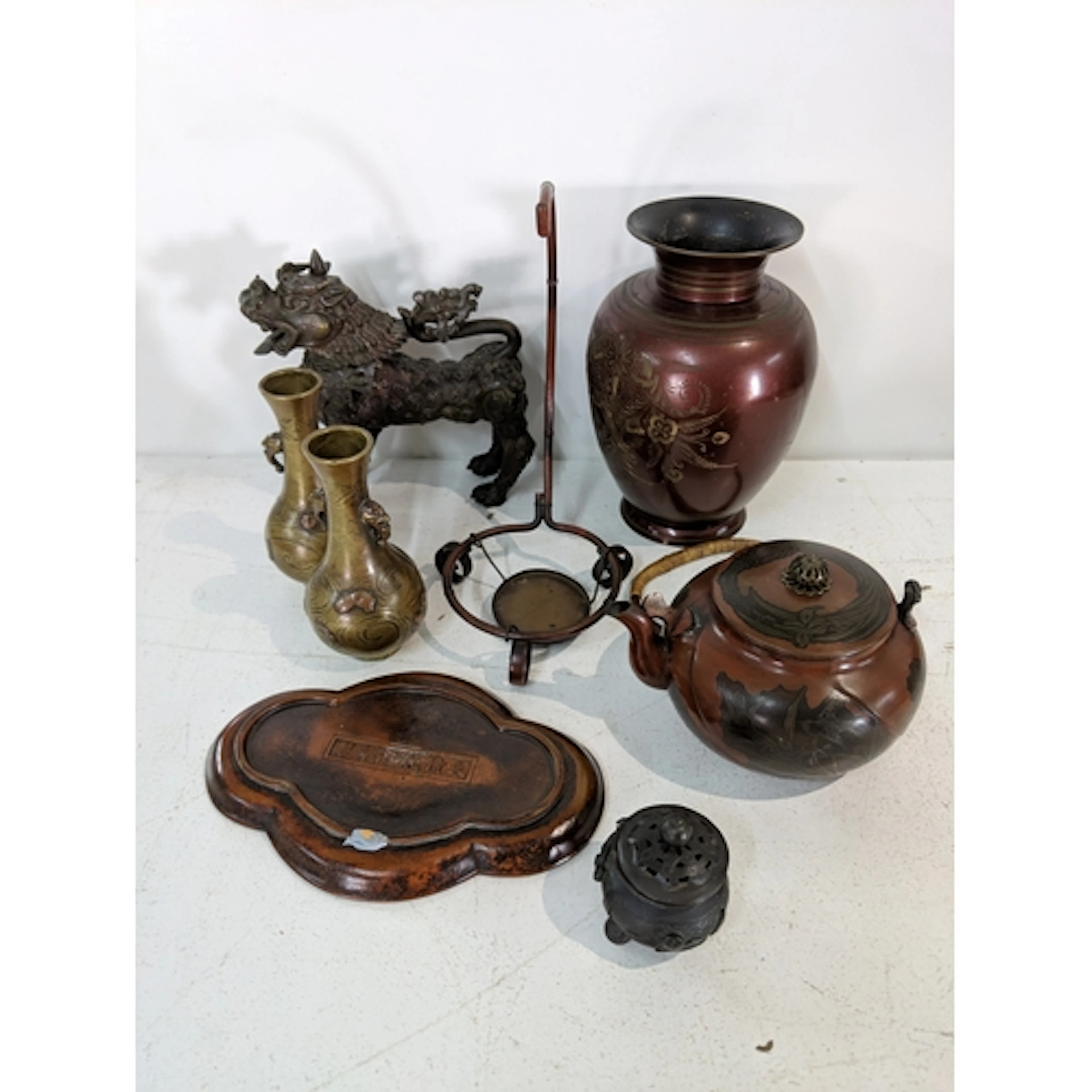 Oriental metalware to include a vase with a bulbous body and...